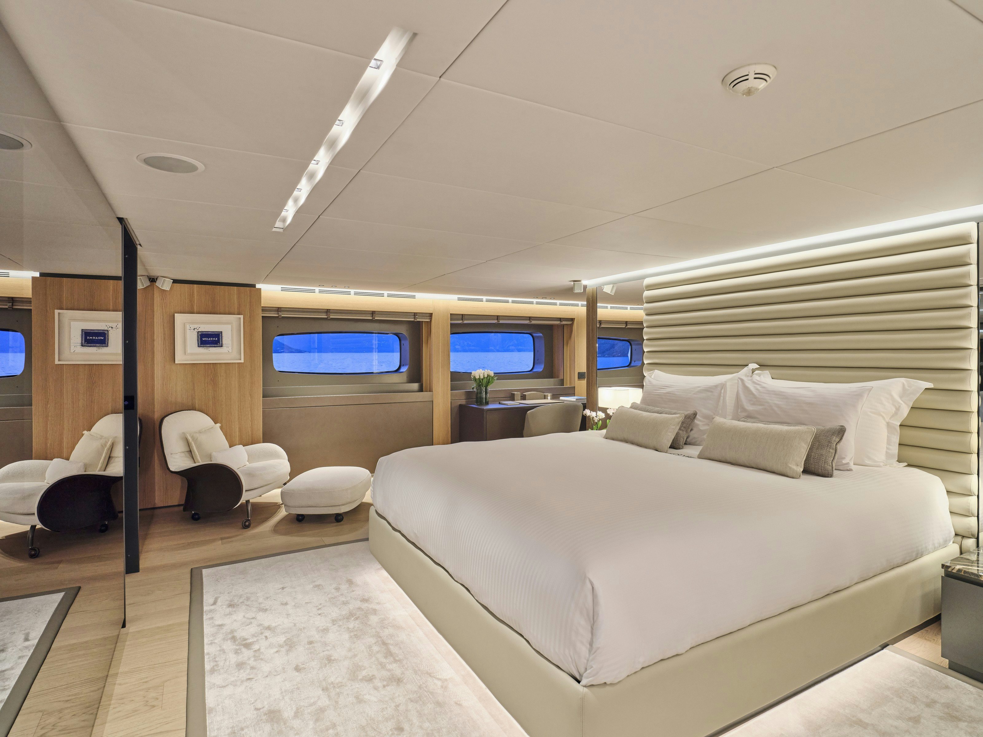 a room with a bed and a tv on the wall aboard MAESTRO Yacht for Charter