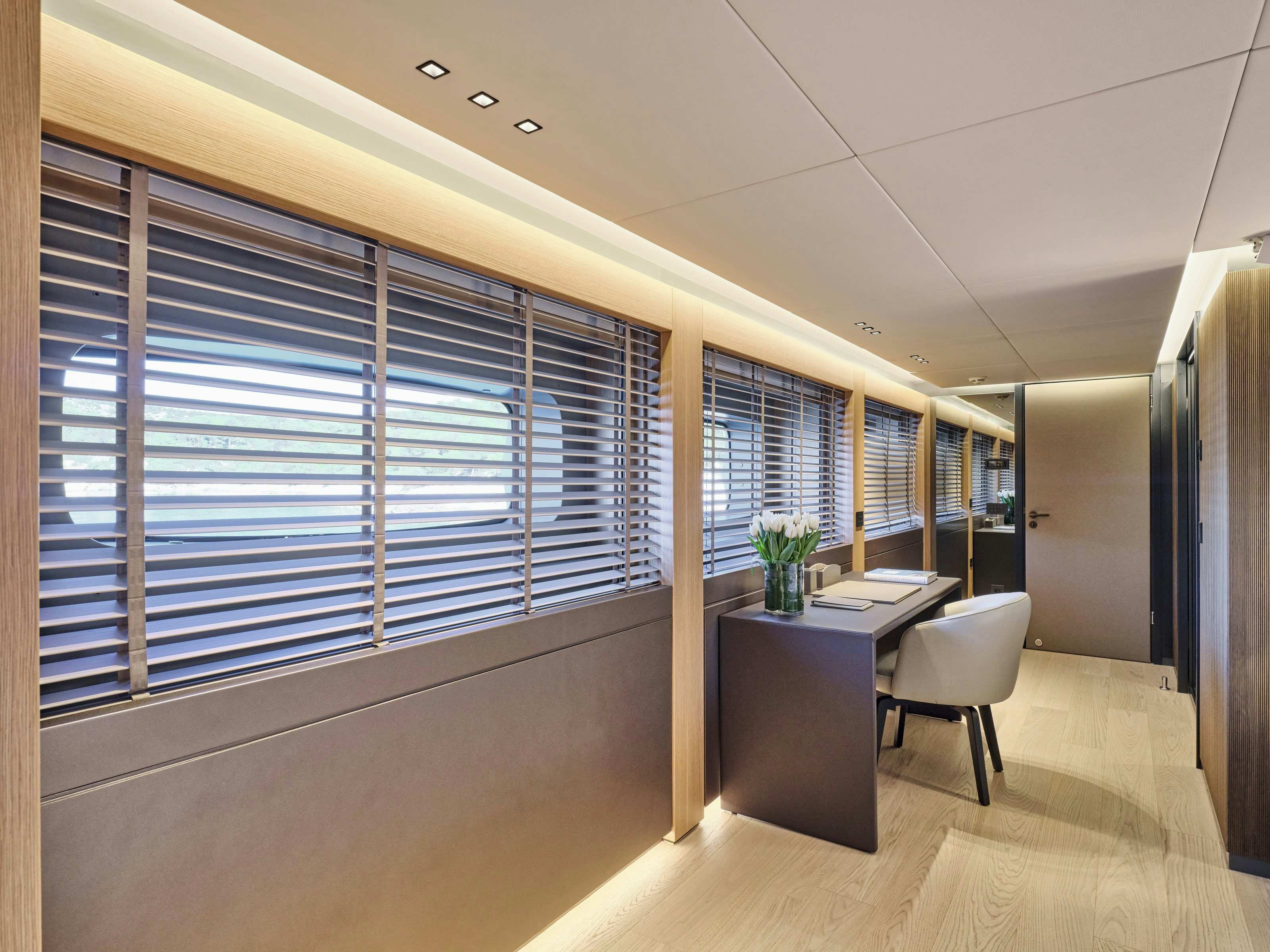 a room with a table and chairs aboard MAESTRO Yacht for Charter