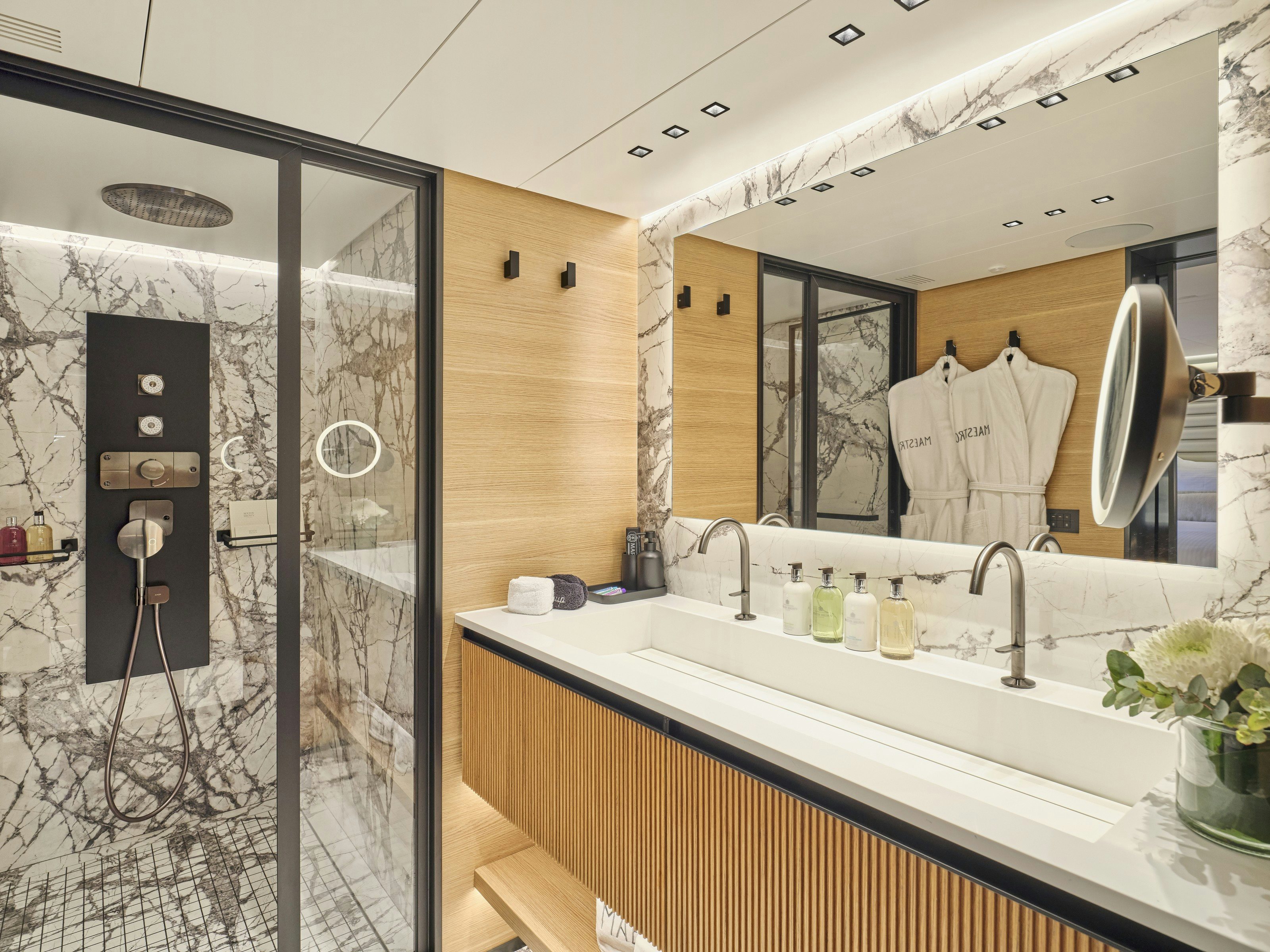 a bathroom with a large mirror aboard MAESTRO Yacht for Charter