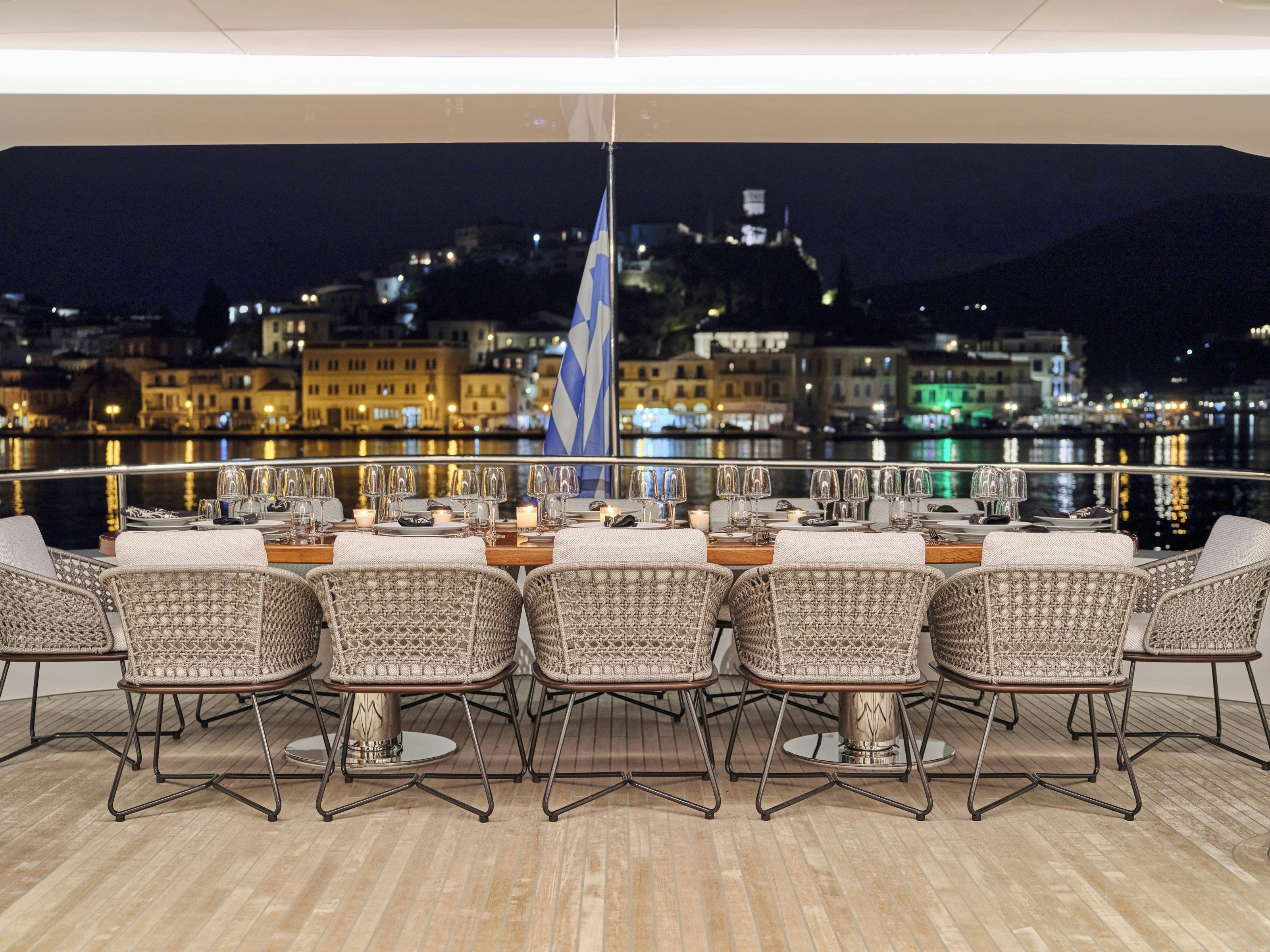 a row of chairs in a room with a table and chairs aboard MAESTRO Yacht for Charter