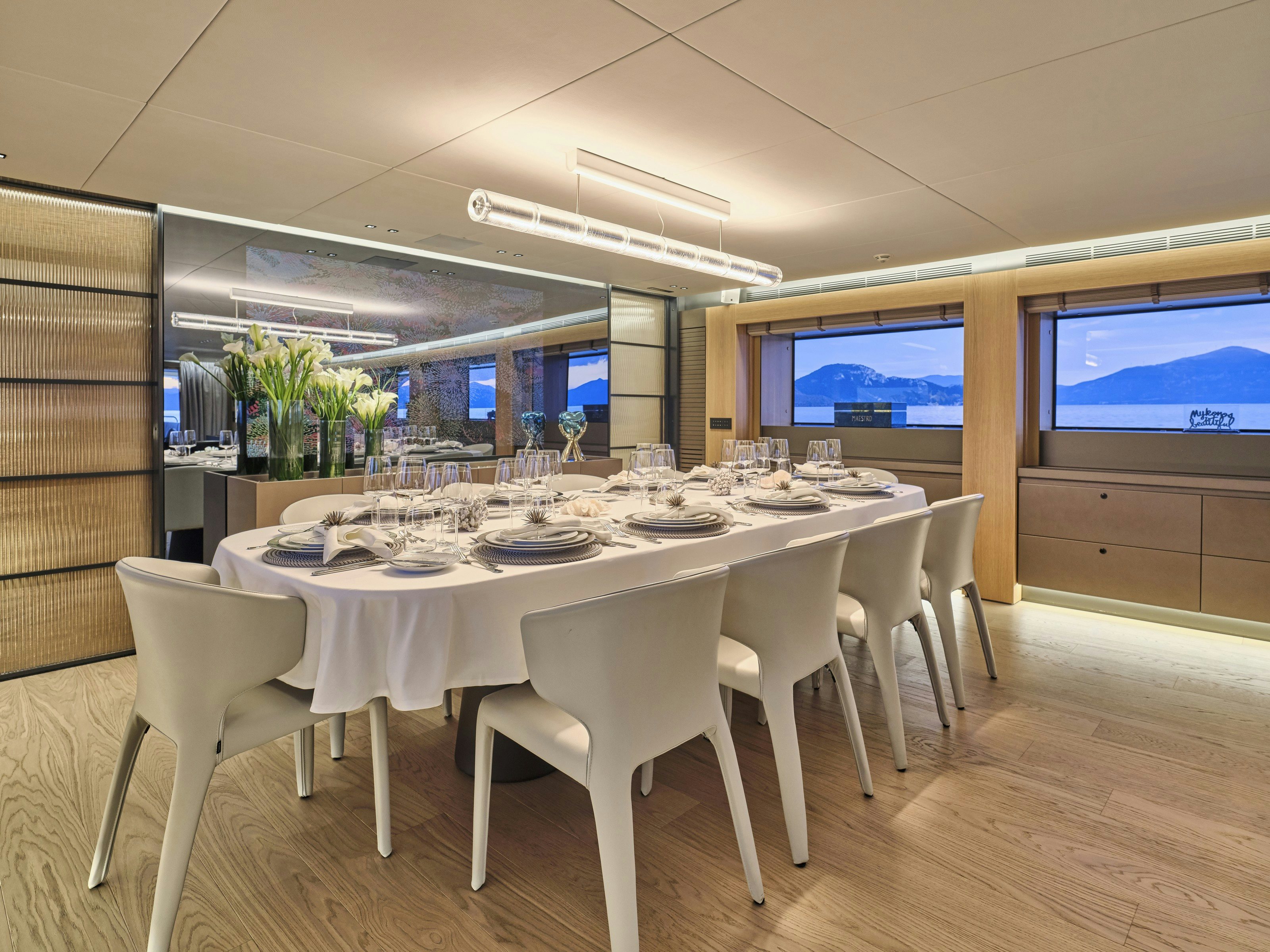 a table set for a dinner aboard MAESTRO Yacht for Charter