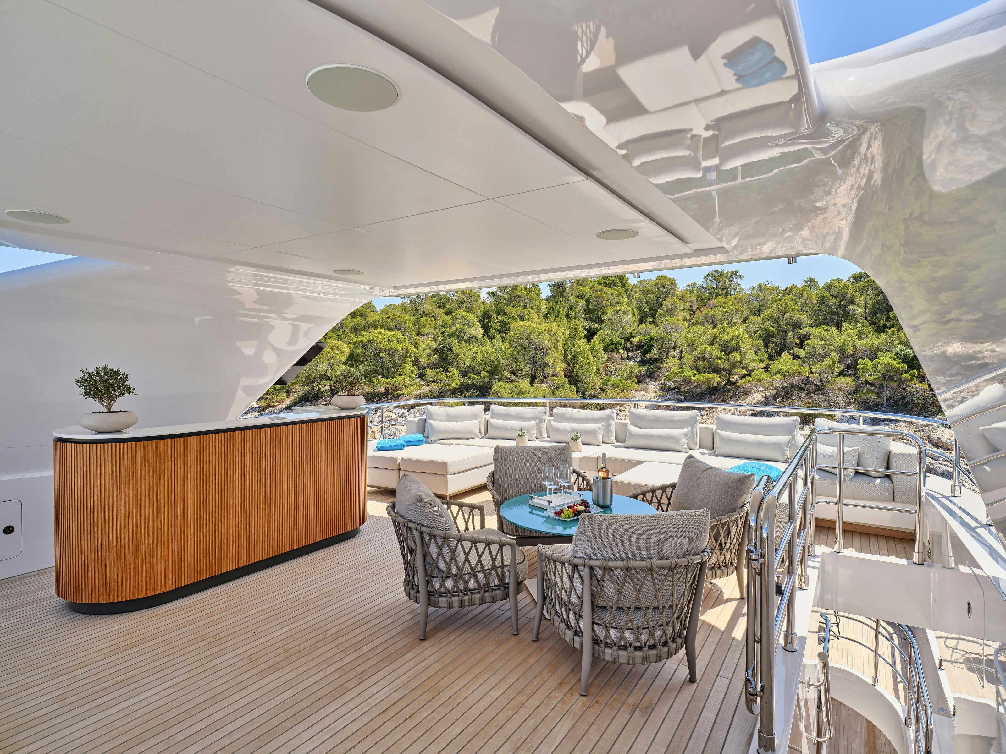 a room with a table and chairs aboard MAESTRO Yacht for Charter