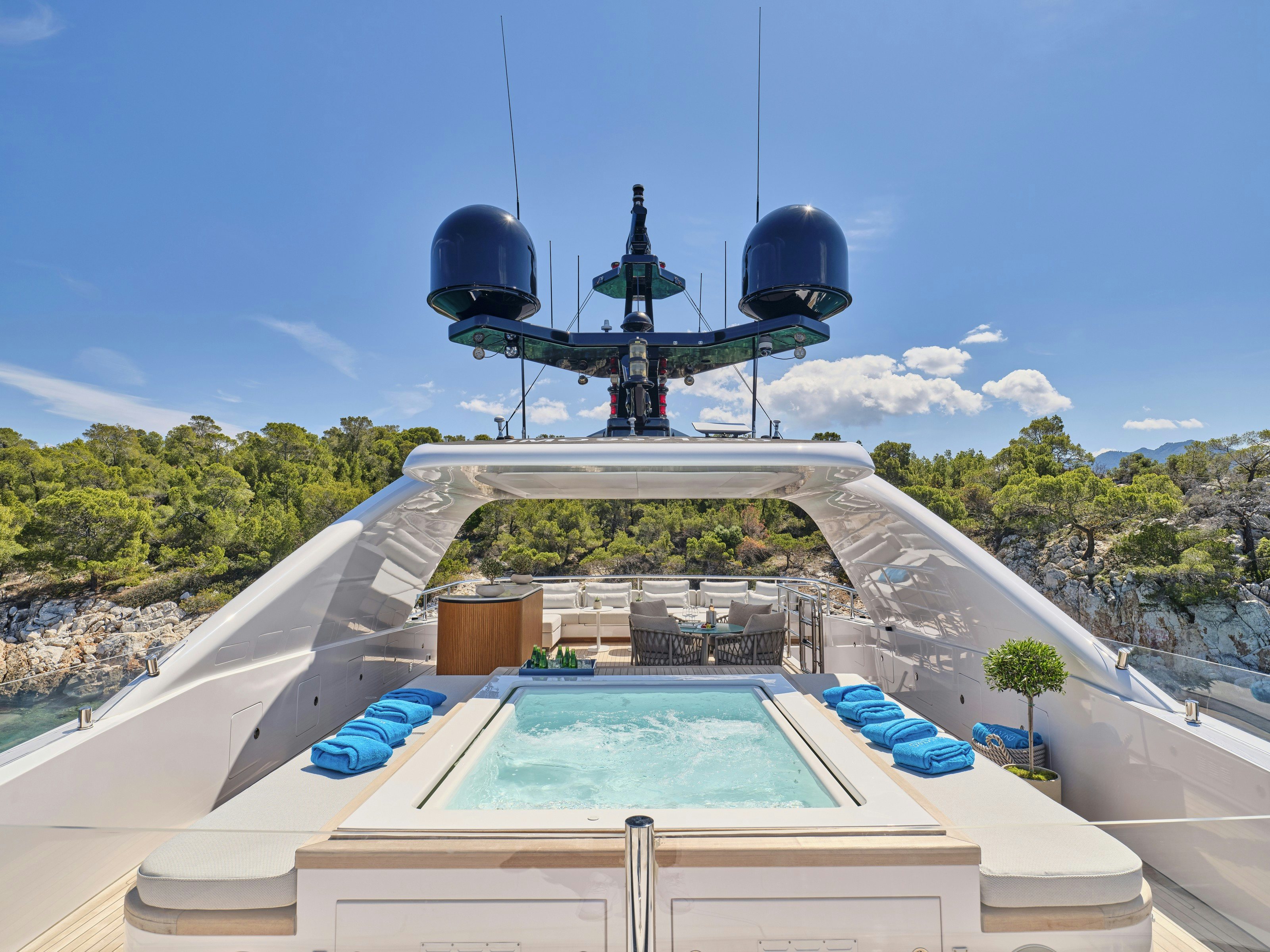 a rooftop with a water slide and a satellite dish on top aboard MAESTRO Yacht for Charter