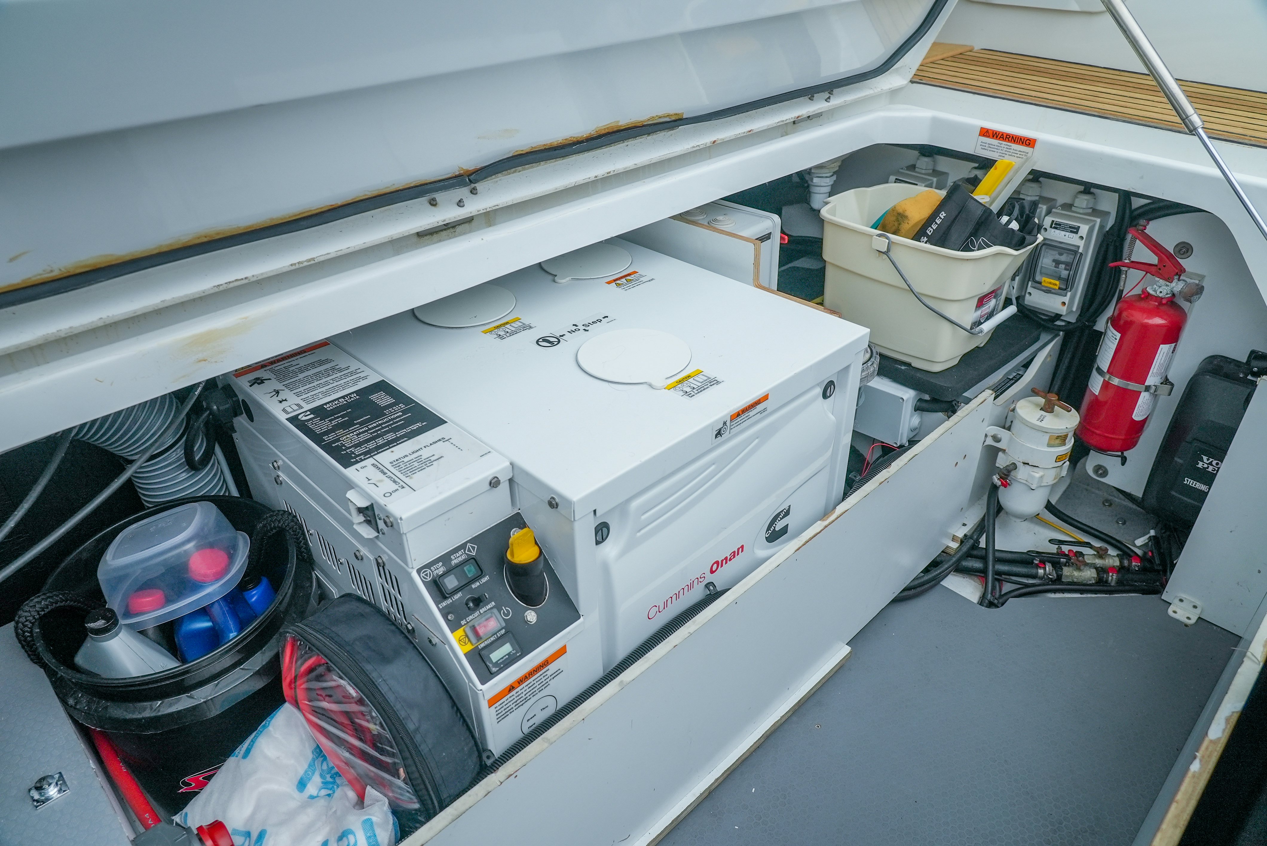 a white machine with a white cover aboard DARK SIDE Yacht for Sale