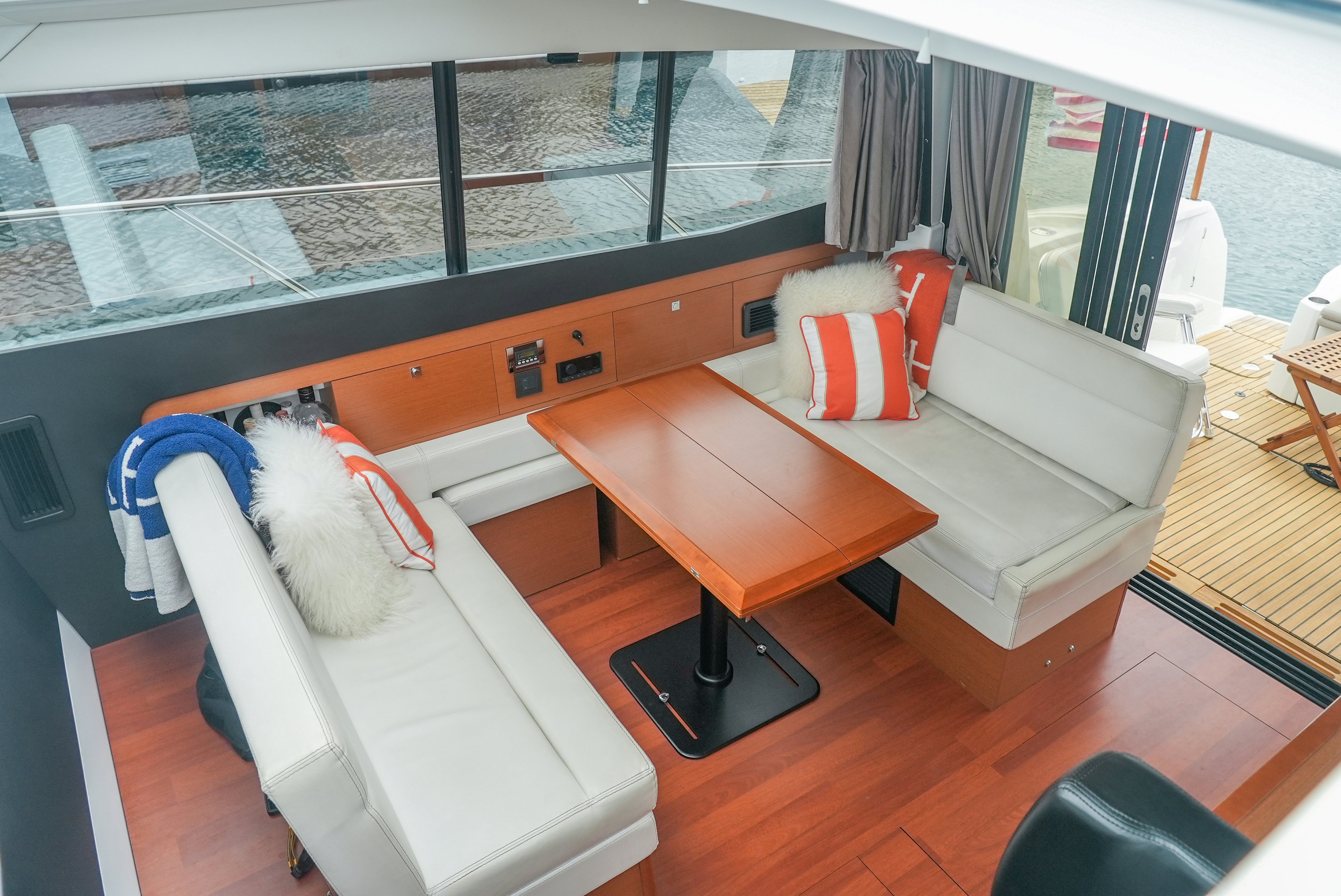 a room with a couch and a table aboard DARK SIDE Yacht for Sale