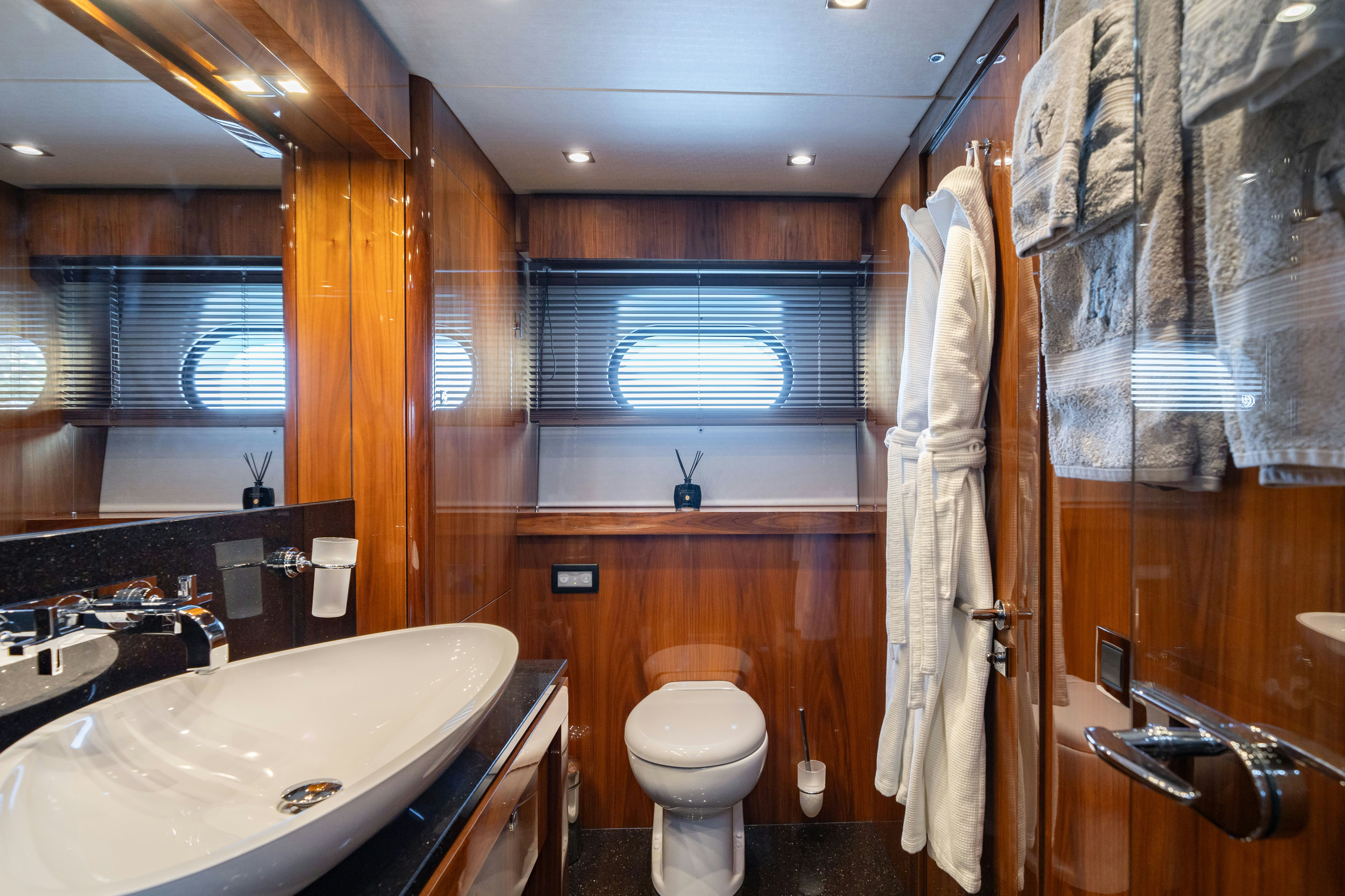 a bathroom with a sink toilet and bathtub aboard LADY VOLANTIS Yacht for Sale