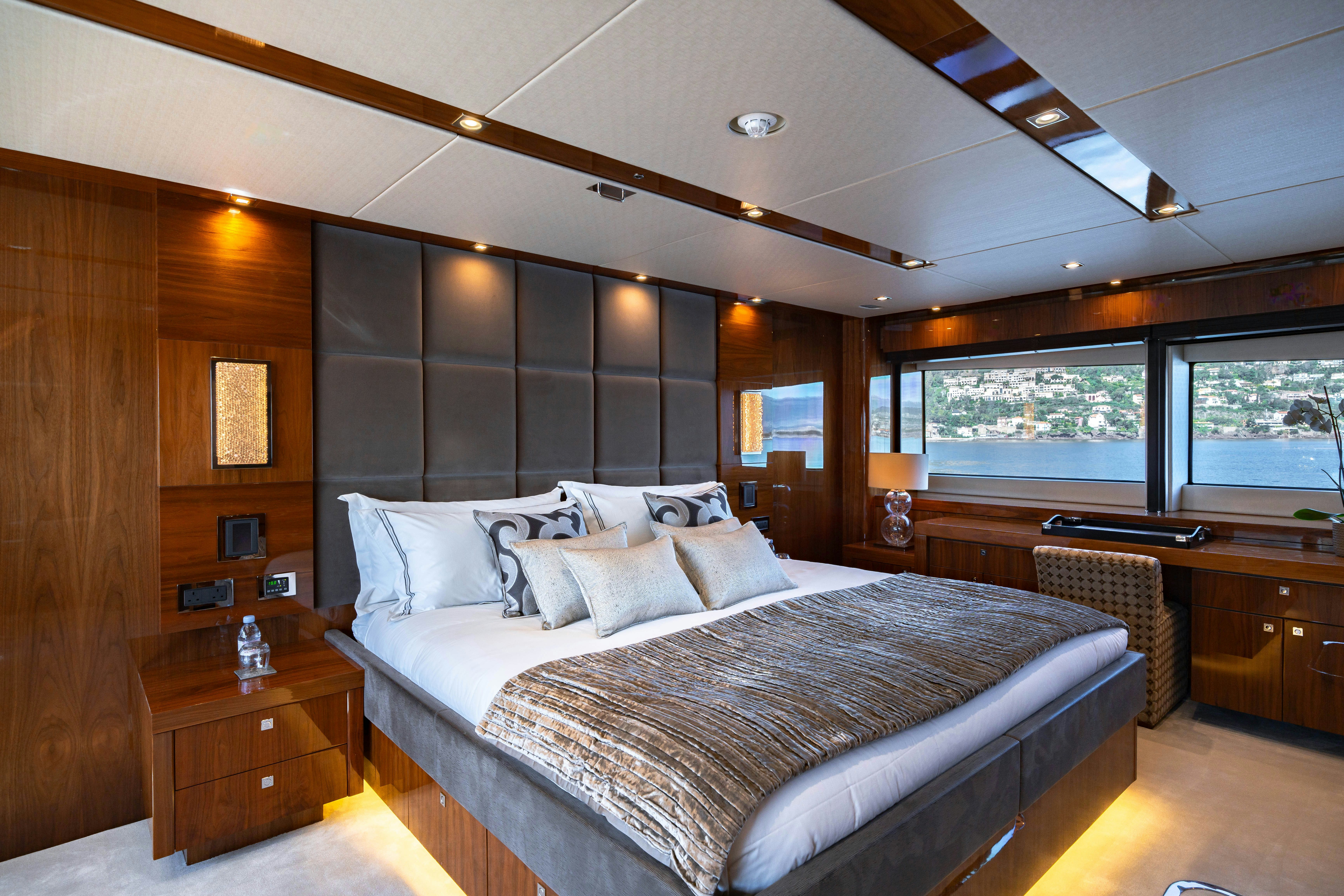a large bed in a room aboard LADY VOLANTIS Yacht for Sale