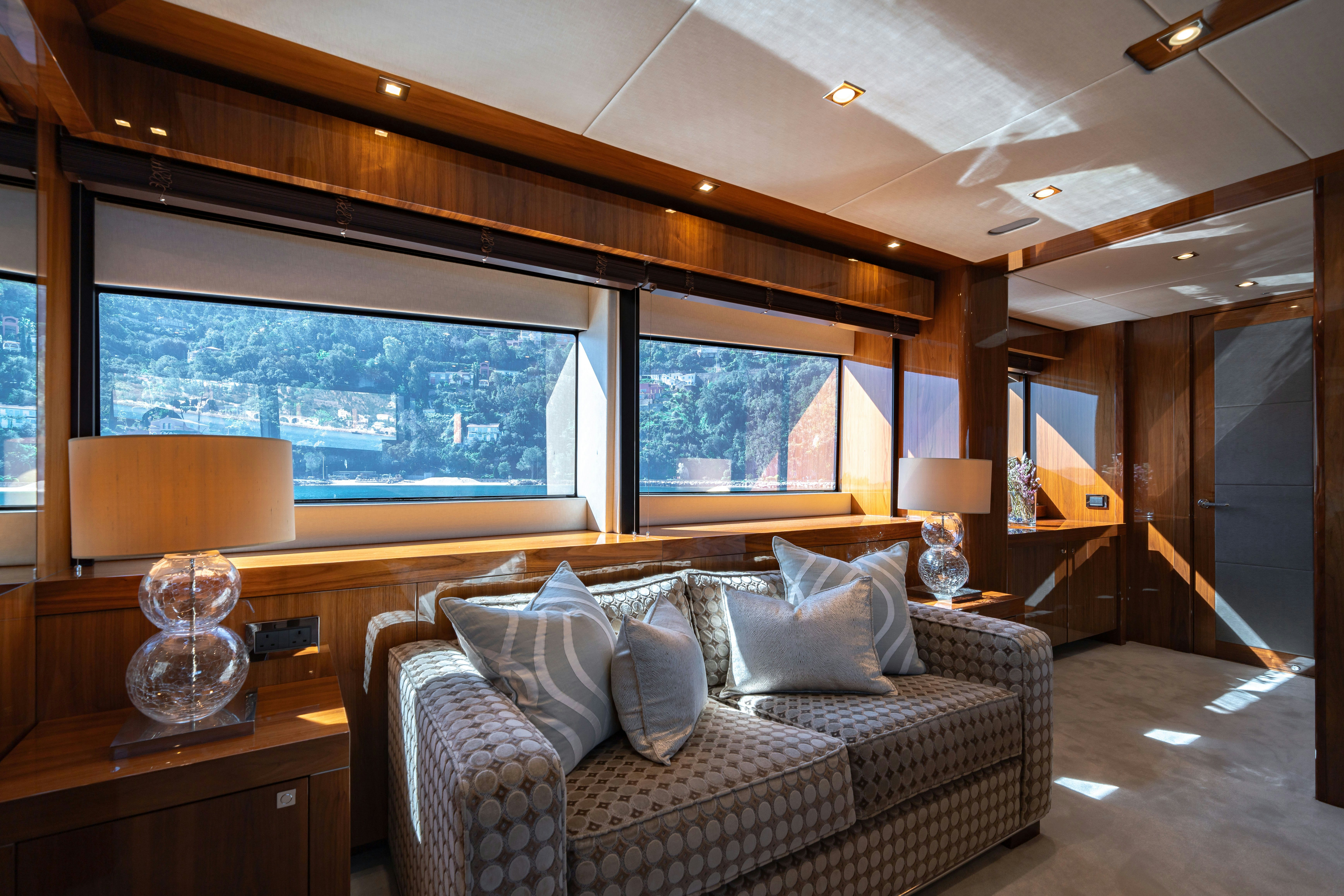 a living room with a large window aboard LADY VOLANTIS Yacht for Sale