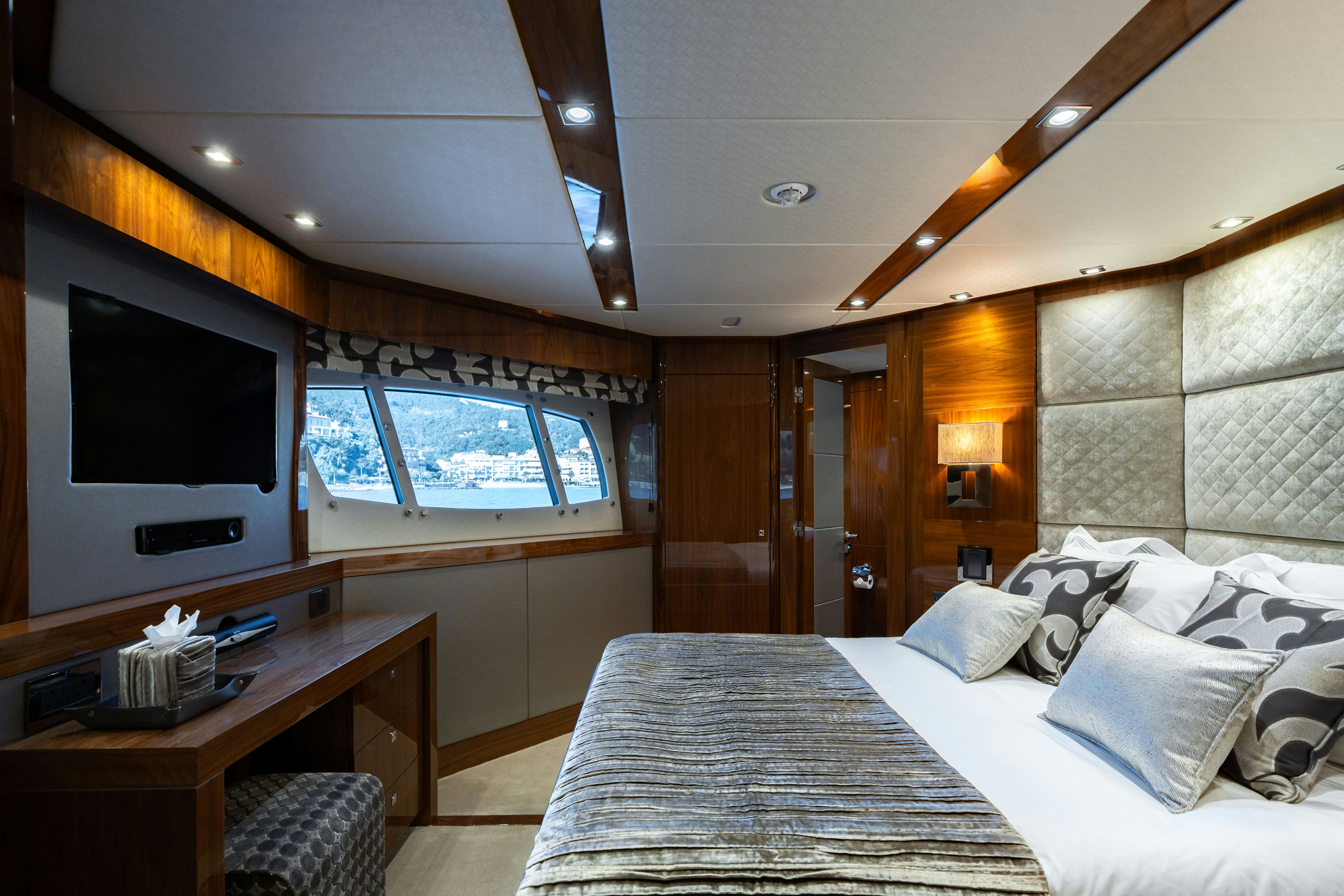 a room with a bed and a tv aboard LADY VOLANTIS Yacht for Sale