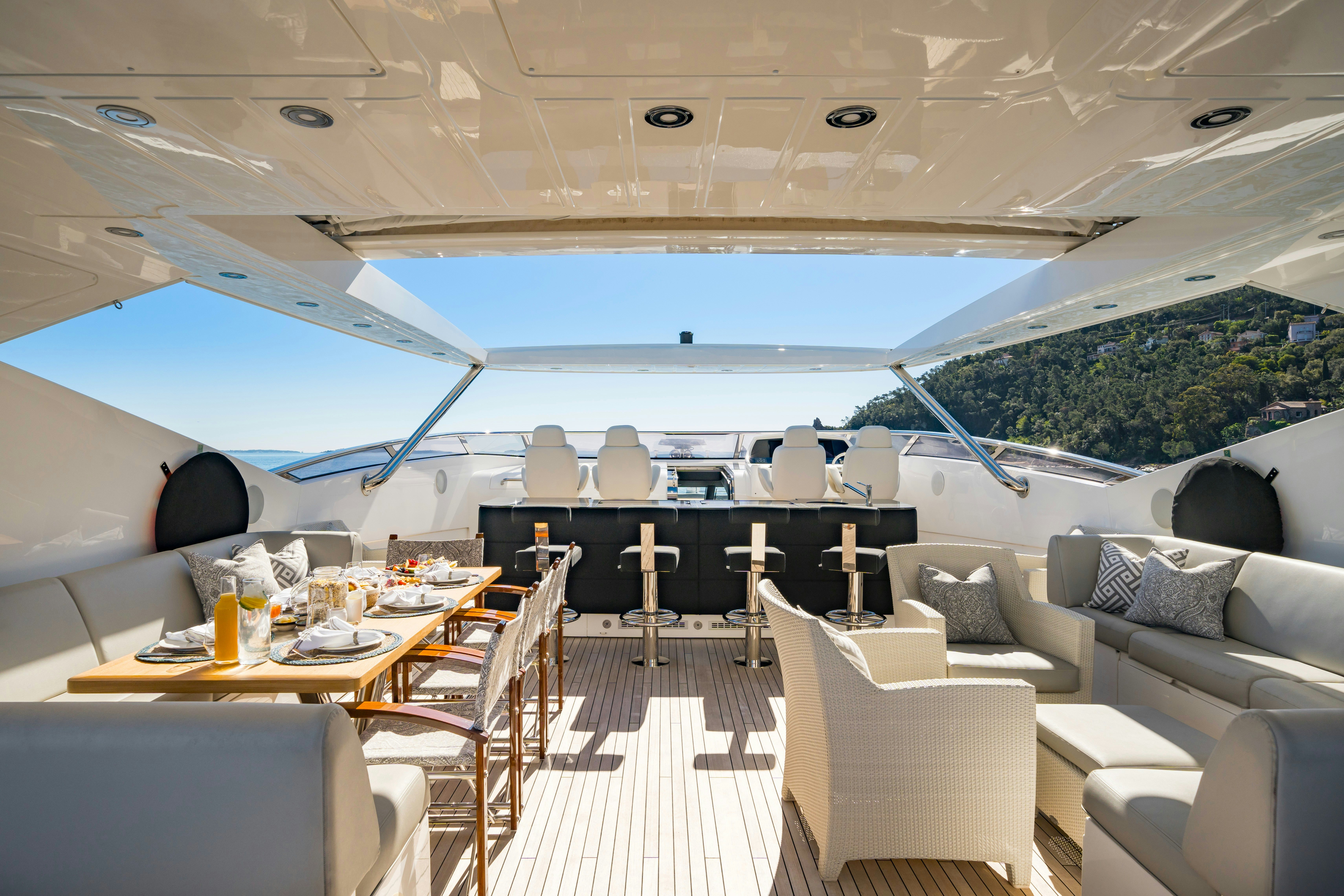 a large lounge area with a table and chairs and a large blue sky aboard LADY VOLANTIS Yacht for Sale