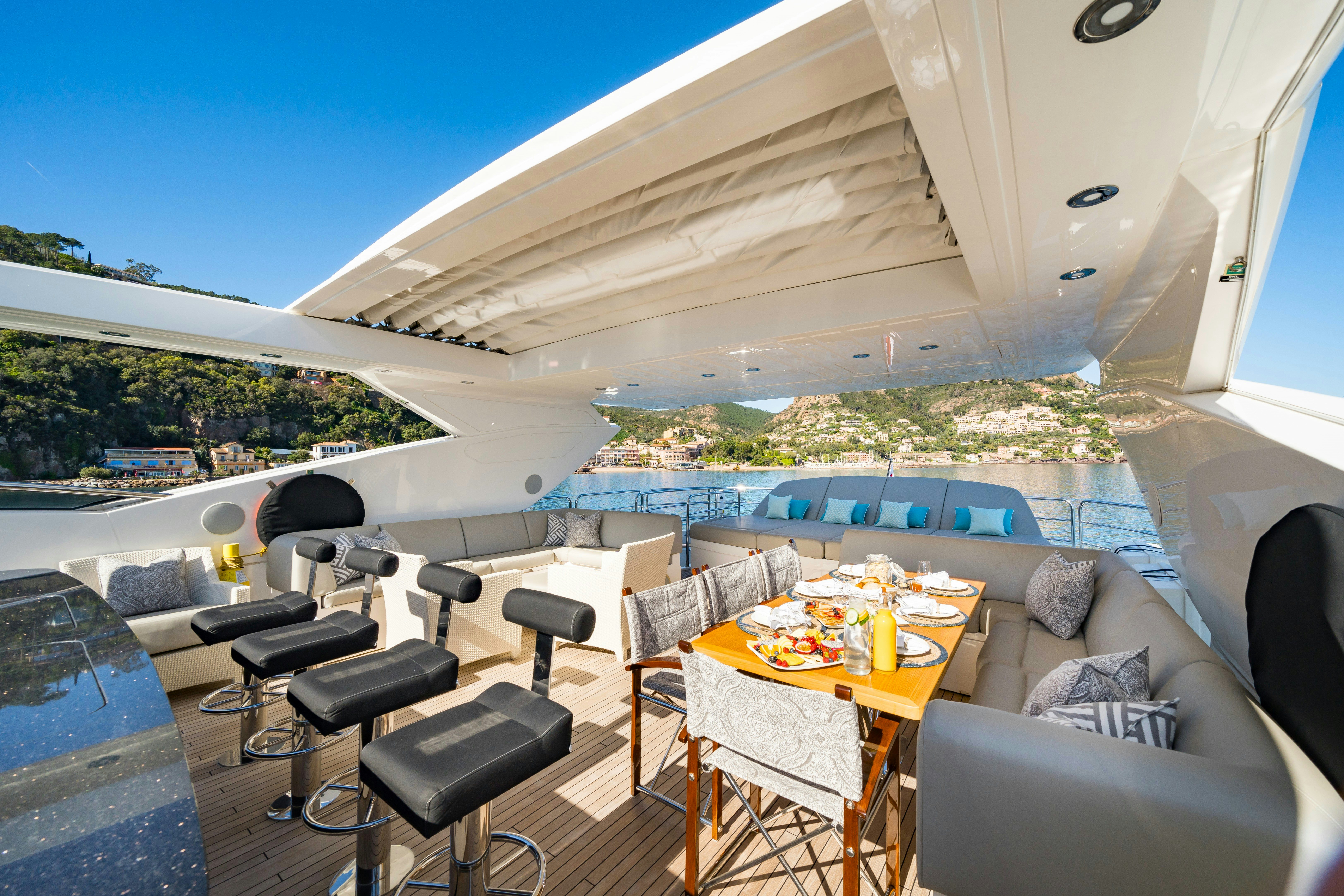 a room with a table and chairs aboard LADY VOLANTIS Yacht for Sale