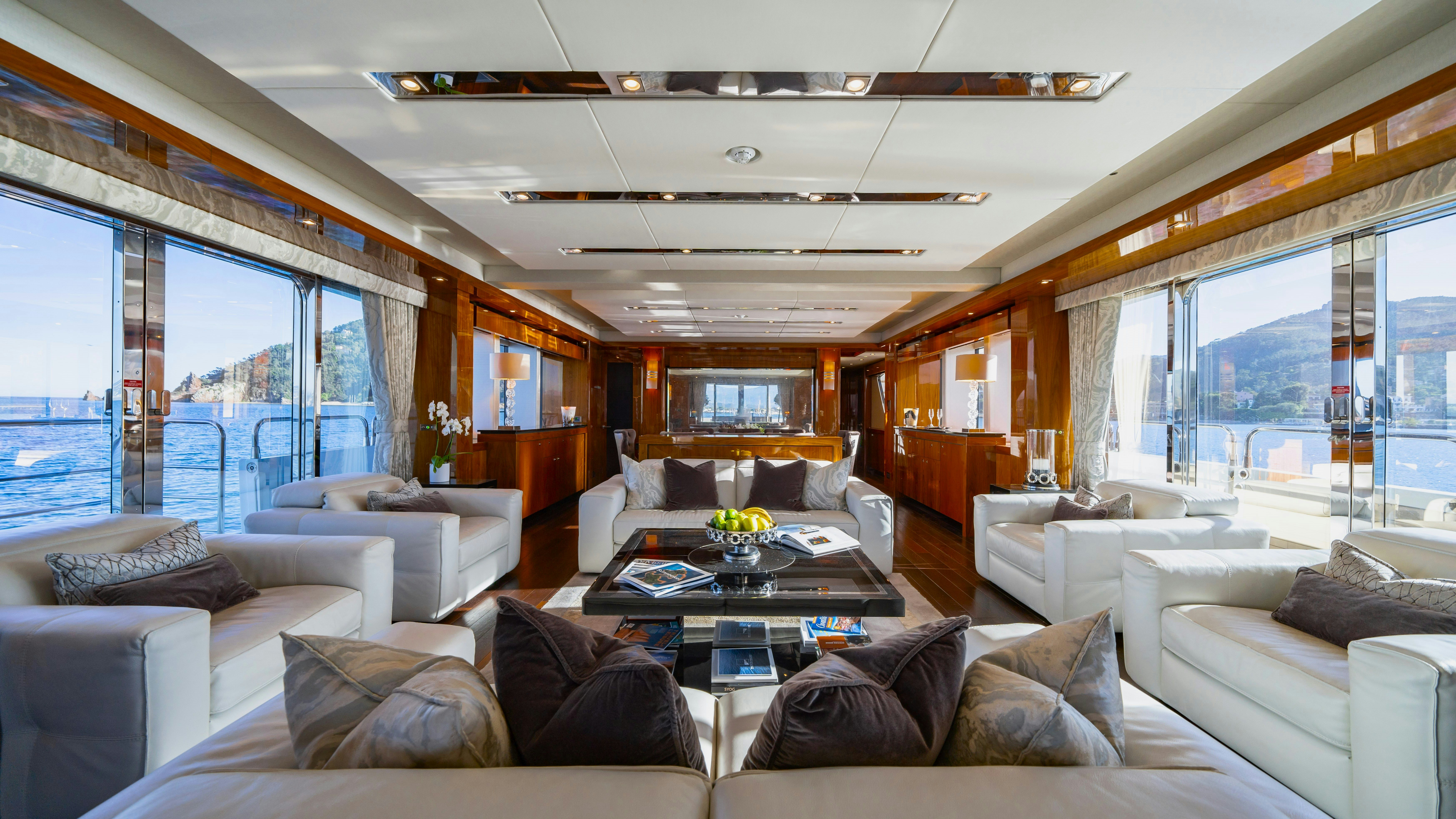 a living room with a large window aboard LADY VOLANTIS Yacht for Sale