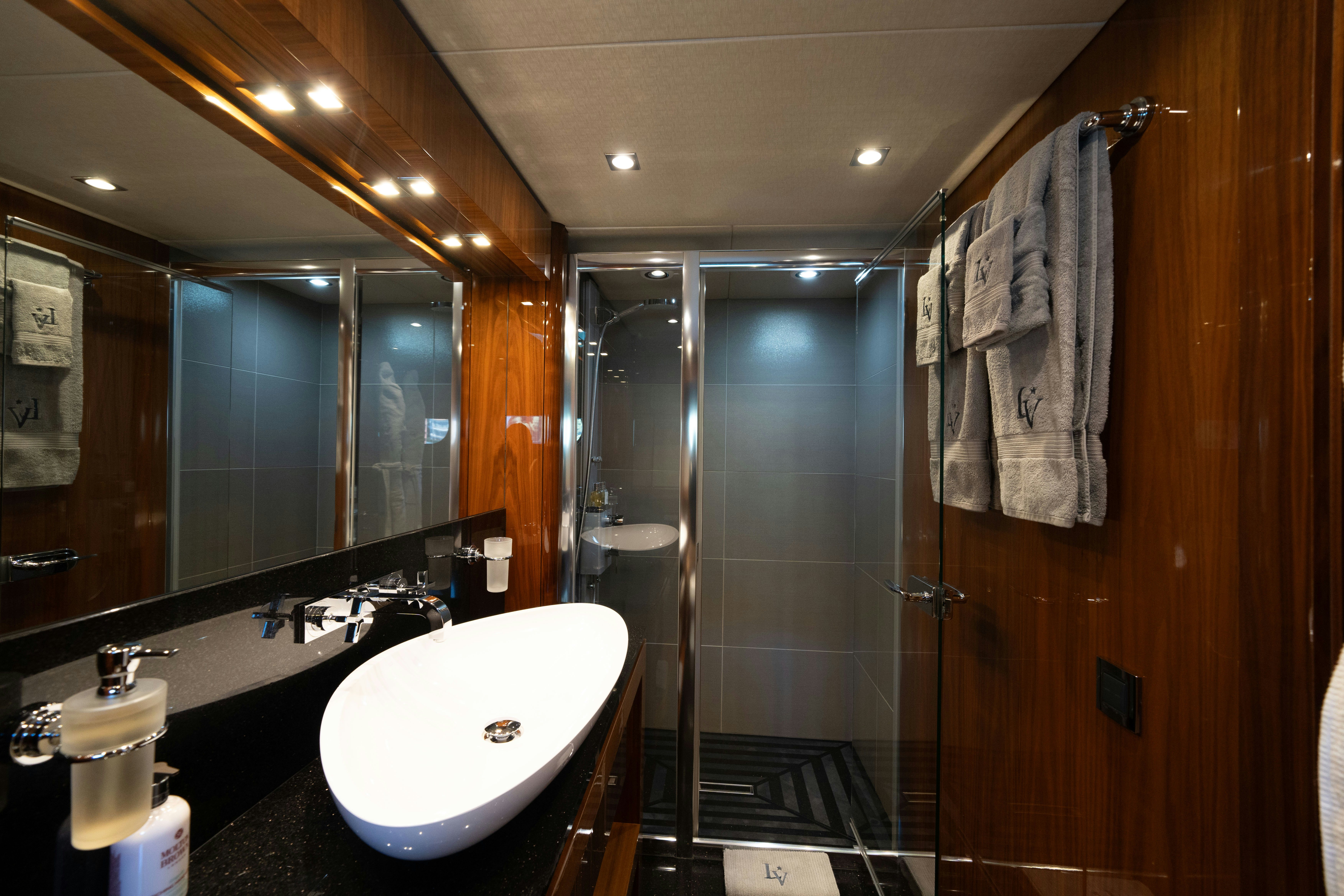 a bathroom with a sink and a shower aboard LADY VOLANTIS Yacht for Sale