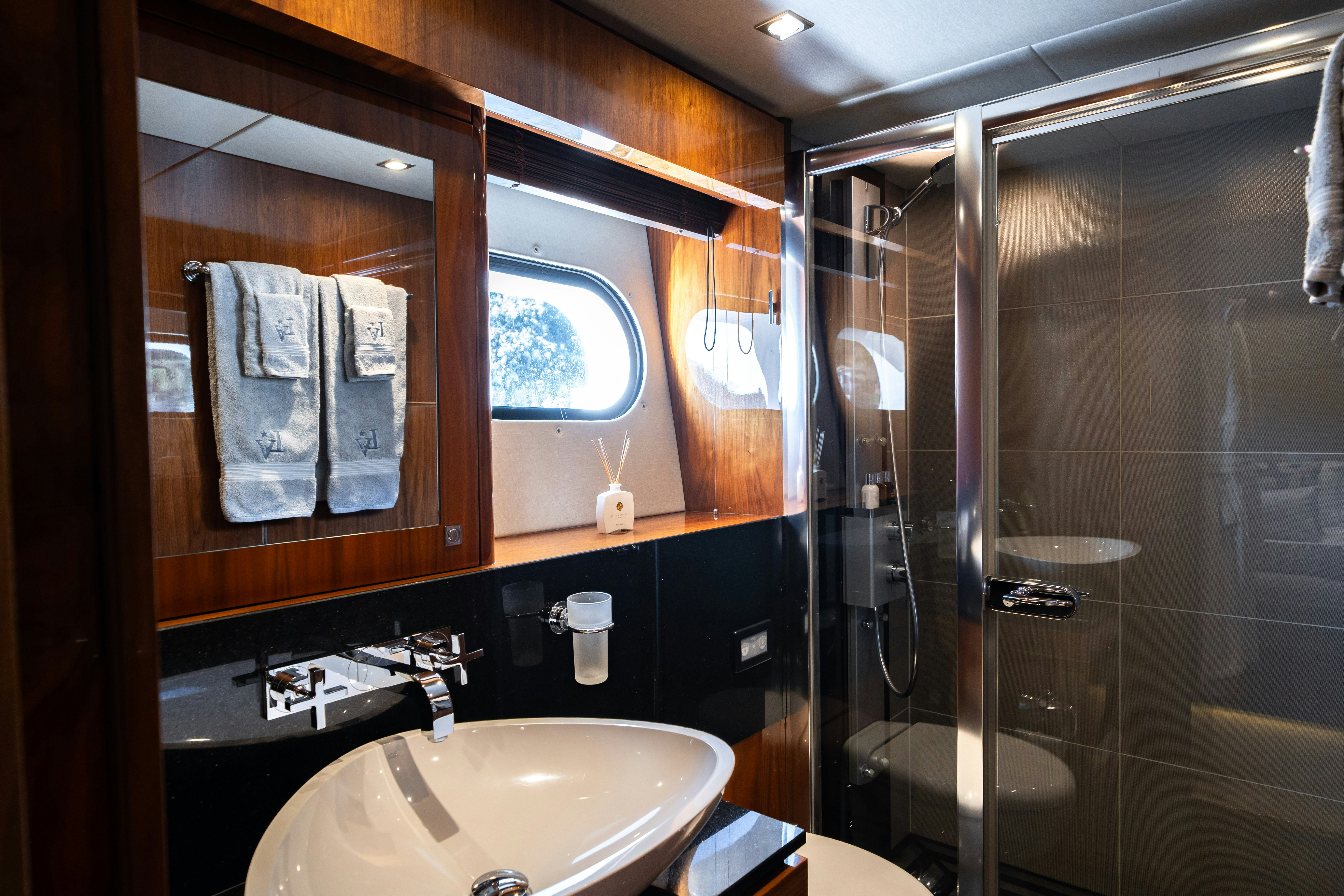 a bathroom with a sink and shower aboard LADY VOLANTIS Yacht for Sale