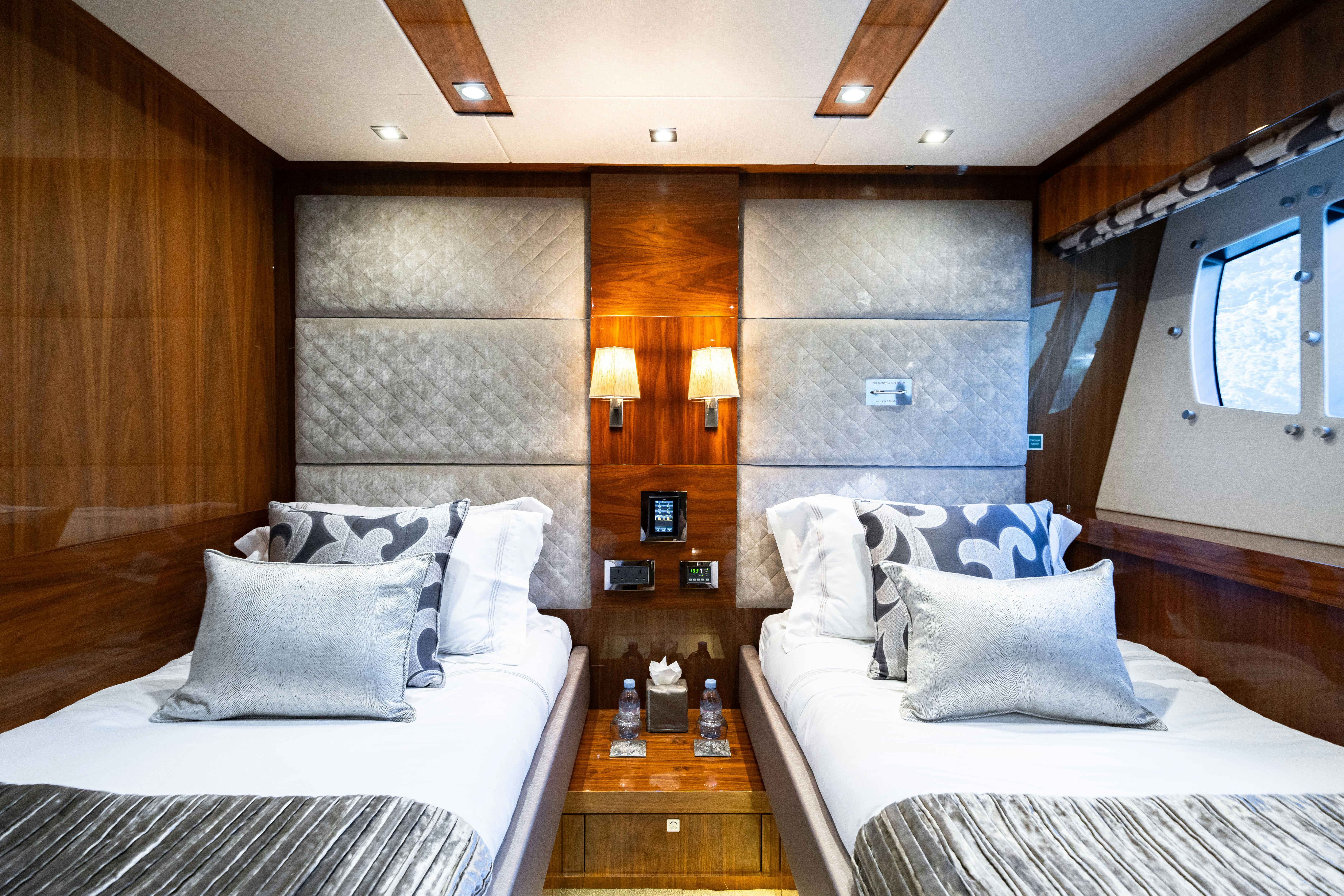 a room with two beds aboard LADY VOLANTIS Yacht for Sale