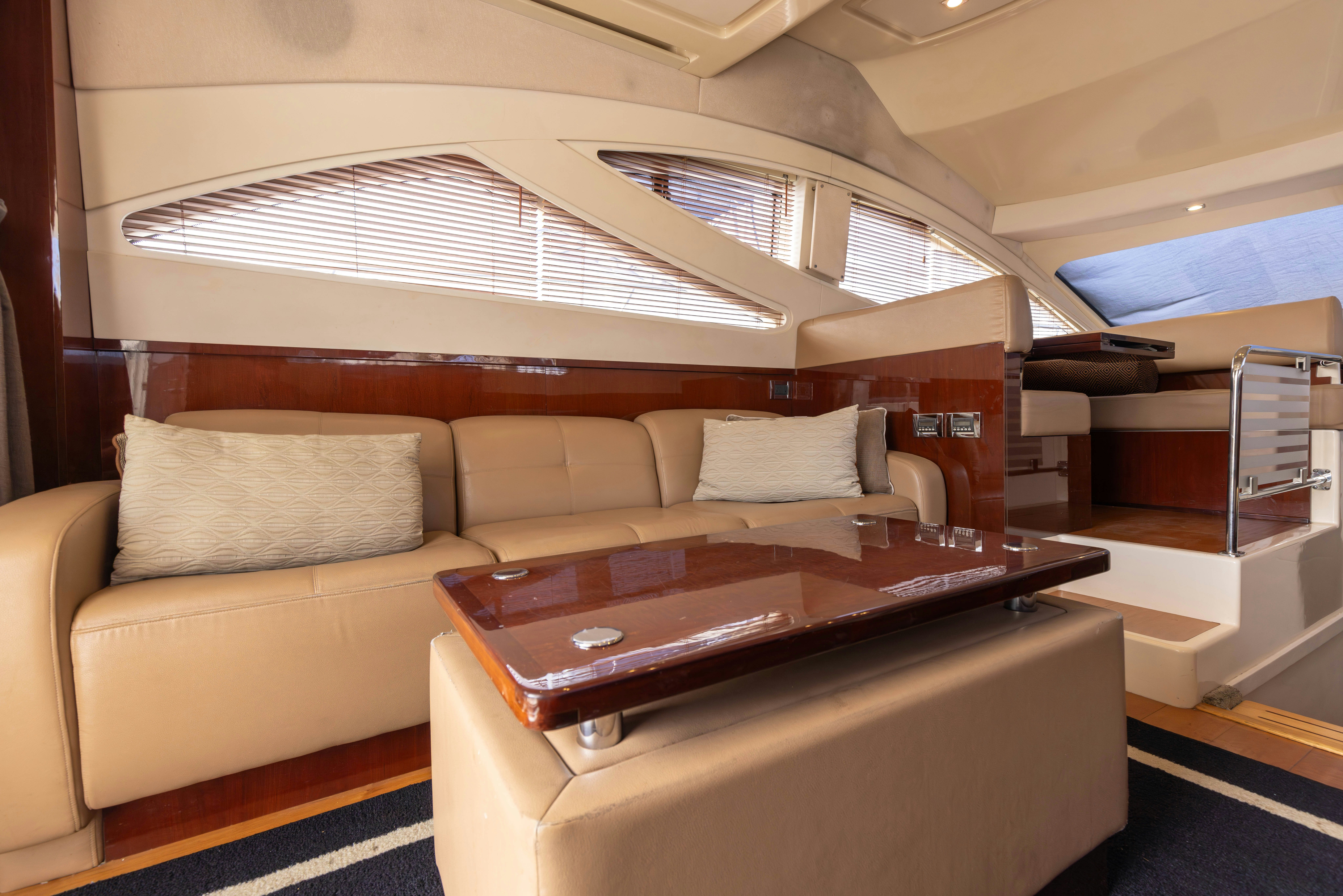 a living room with a couch and a table aboard KA-BAR Yacht for Sale