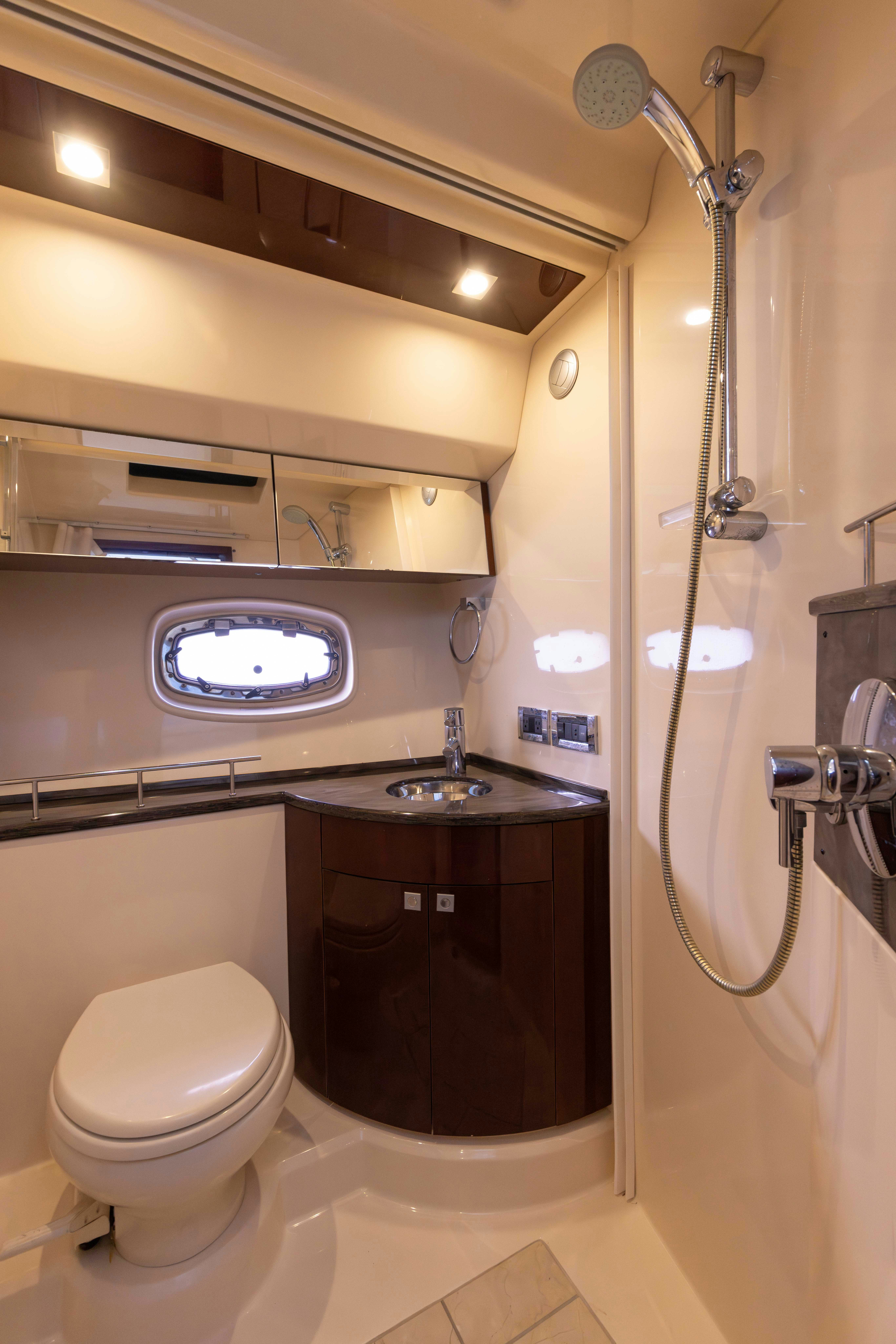 a bathroom with a toilet and a sink aboard KA-BAR Yacht for Sale