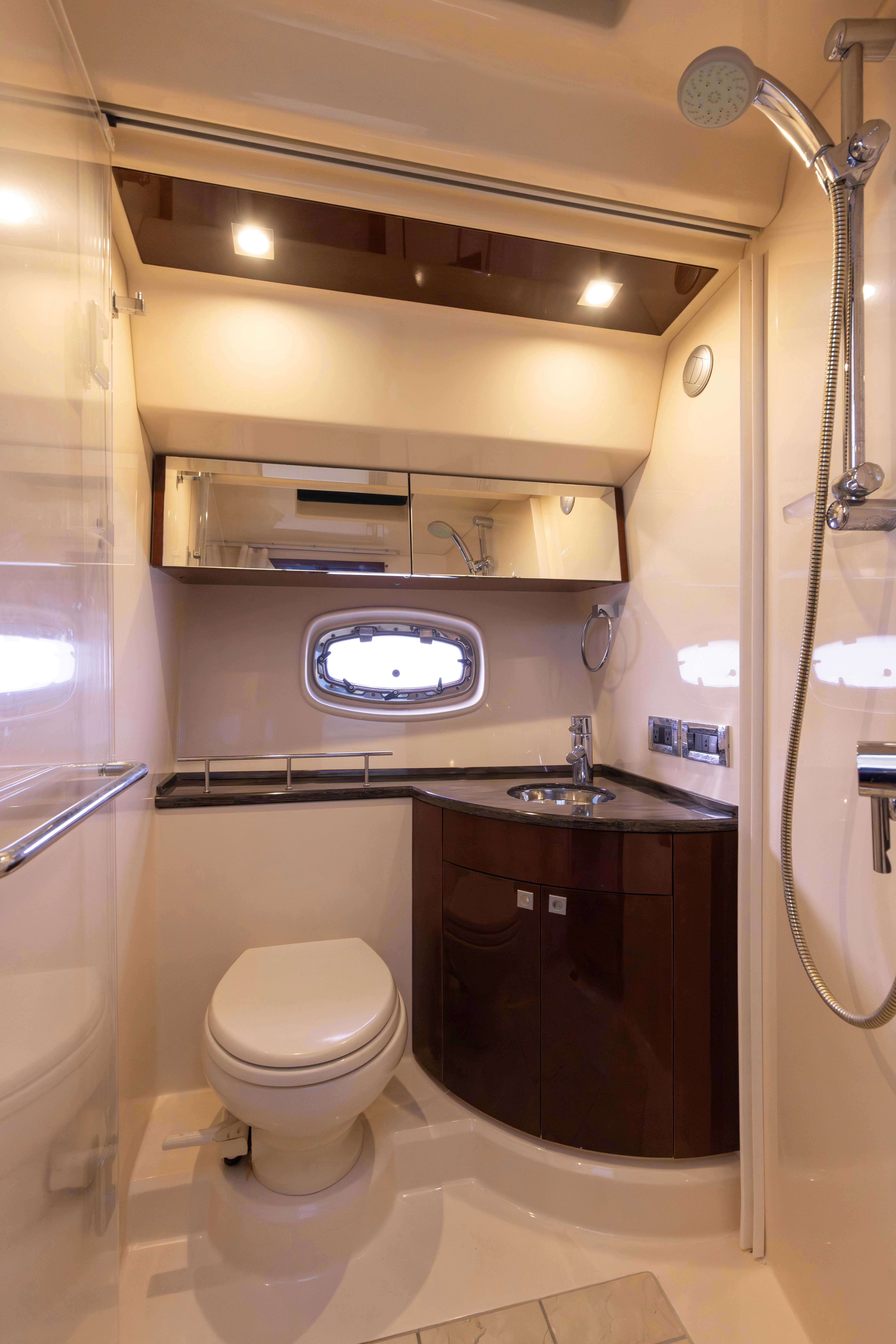 a bathroom with a toilet and sink aboard KA-BAR Yacht for Sale