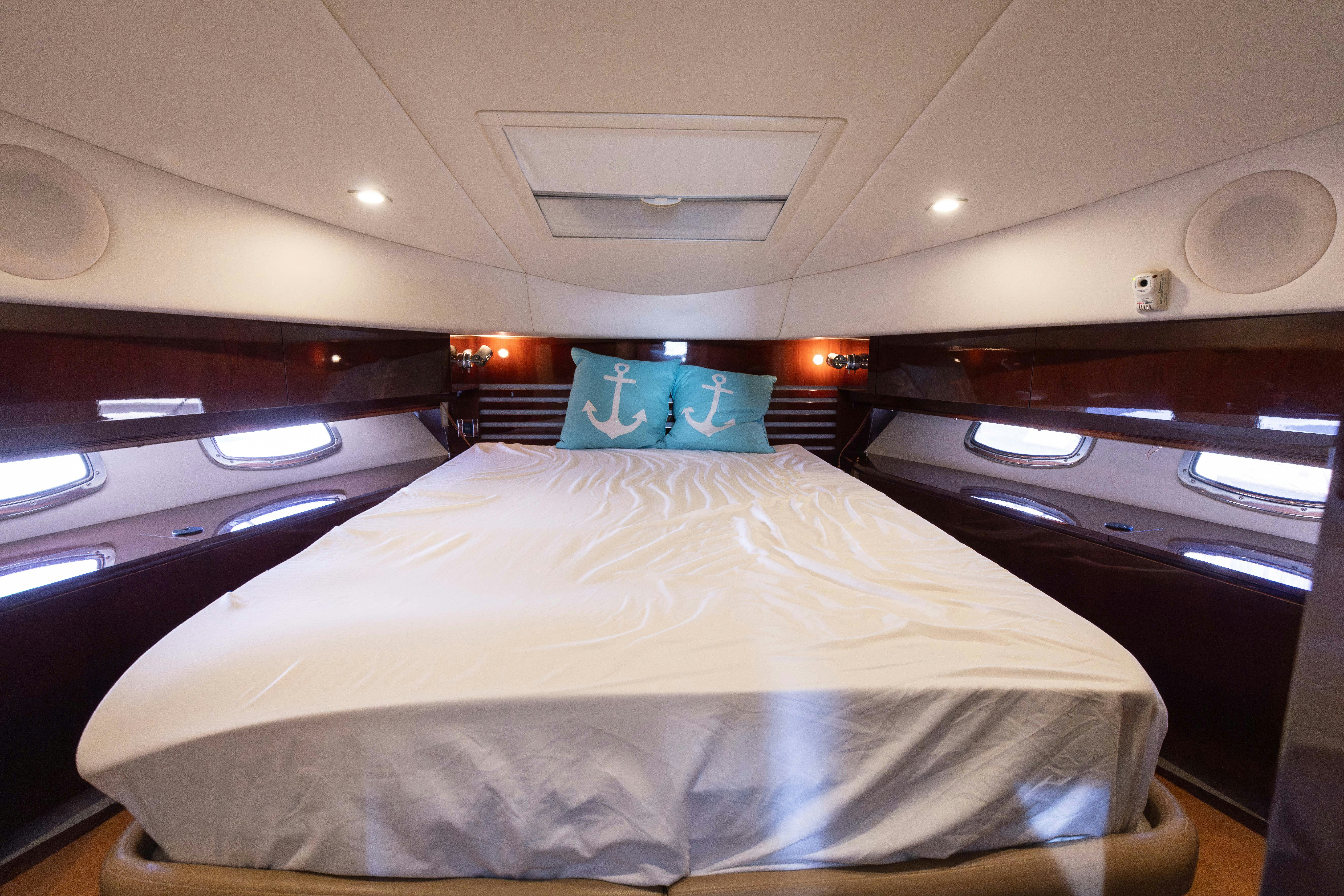 a bed in a room aboard KA-BAR Yacht for Sale