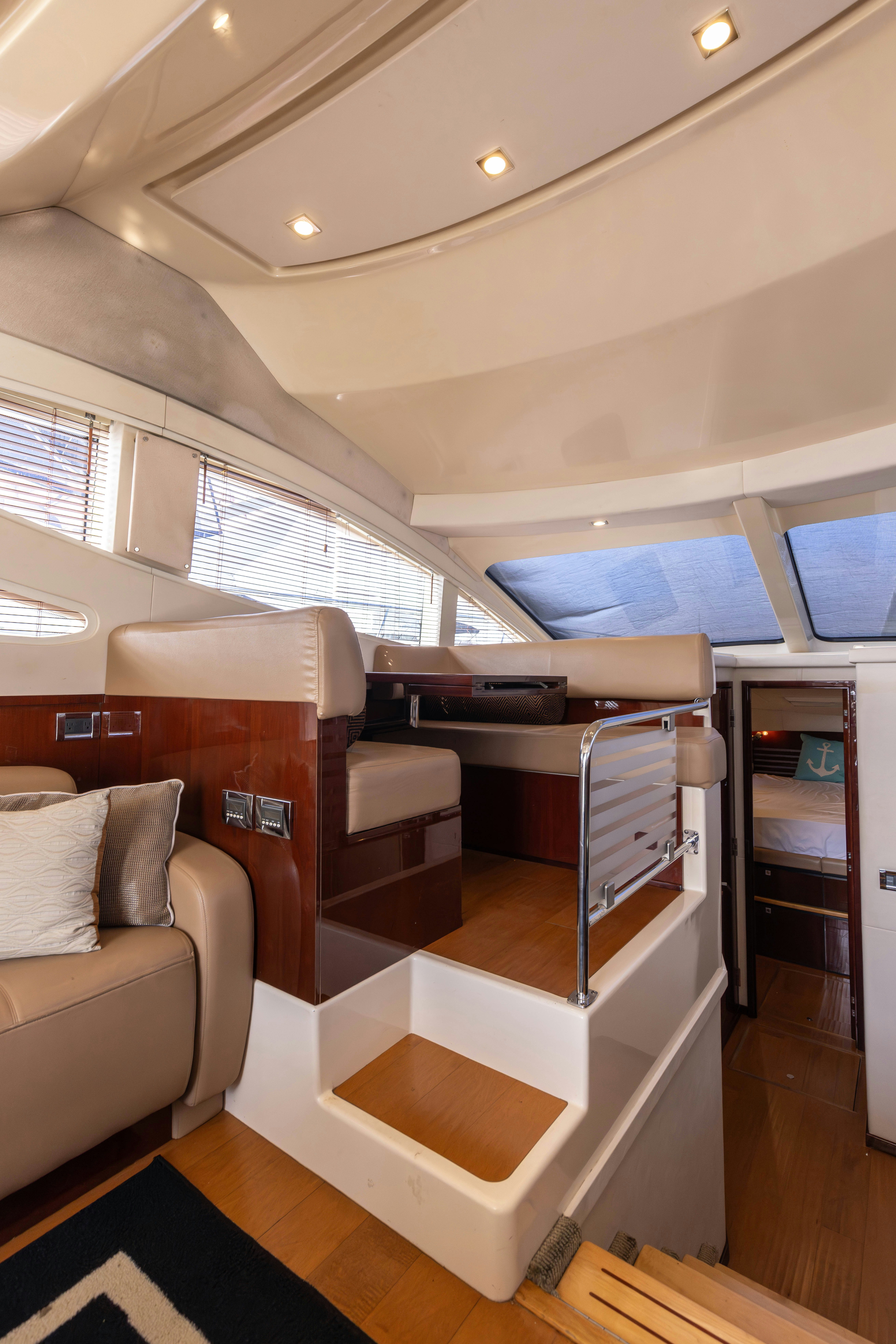 a room with a couch and a table aboard KA-BAR Yacht for Sale