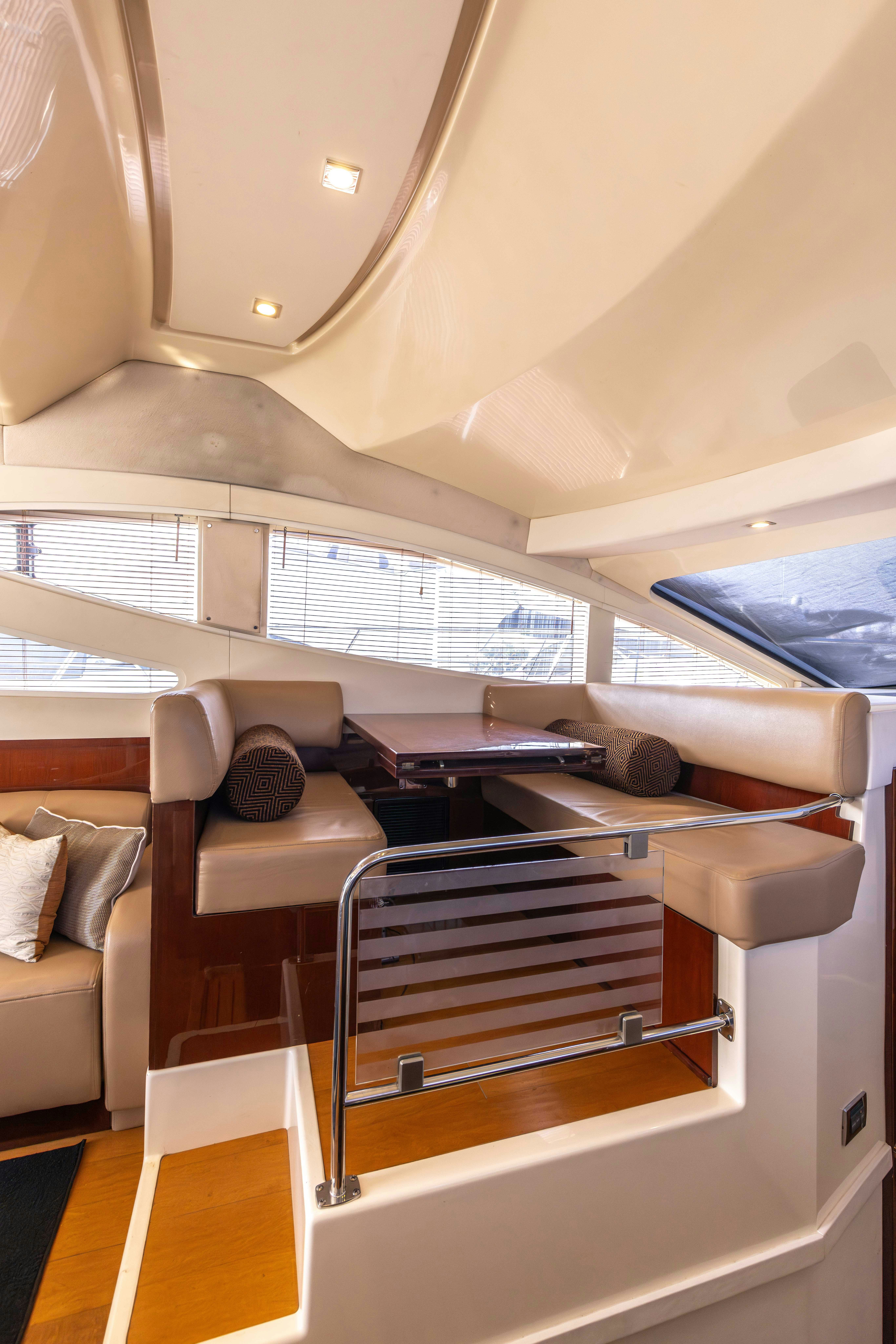 a room with a bed and a couch aboard KA-BAR Yacht for Sale