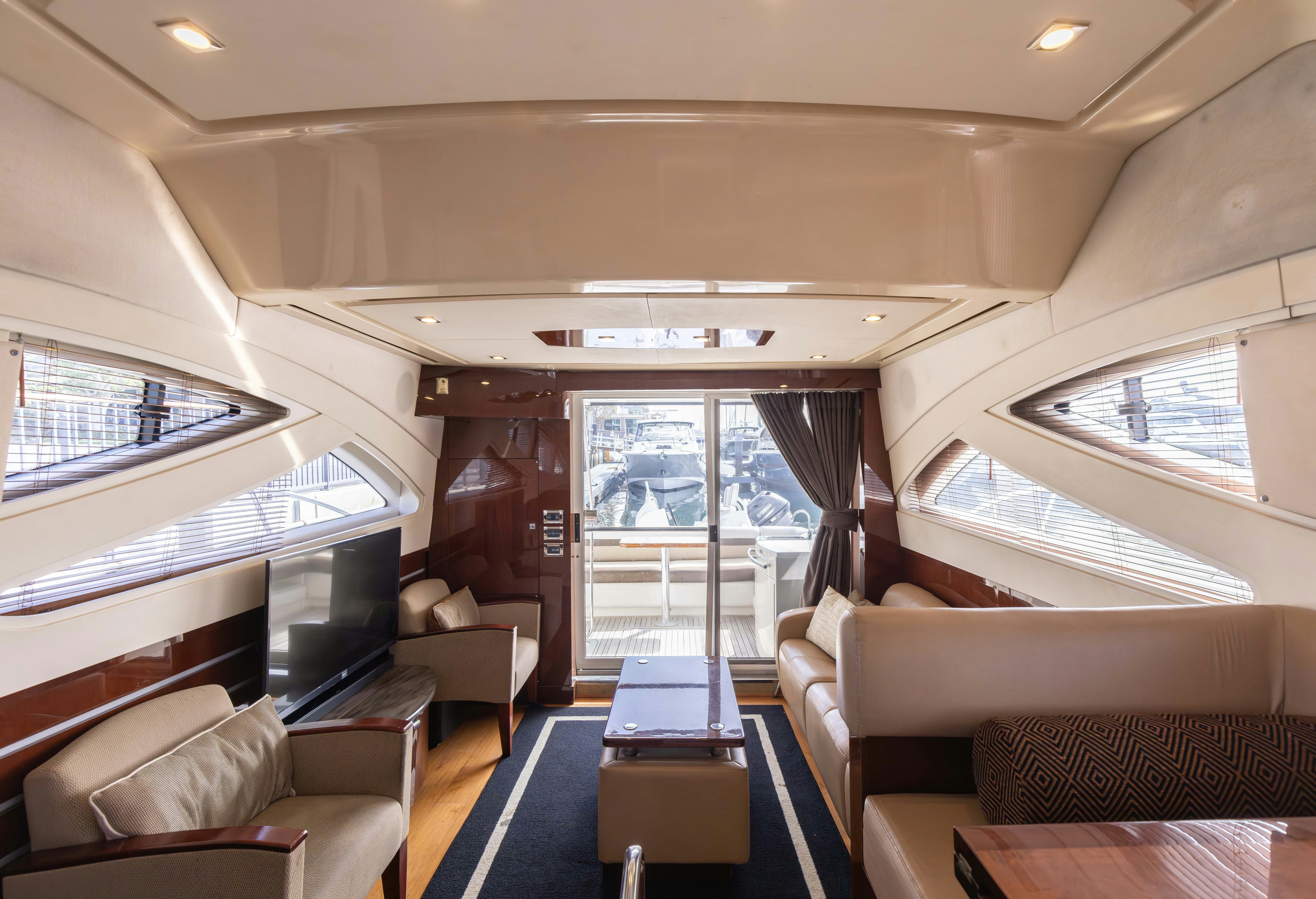 a living room with a large window aboard KA-BAR Yacht for Sale