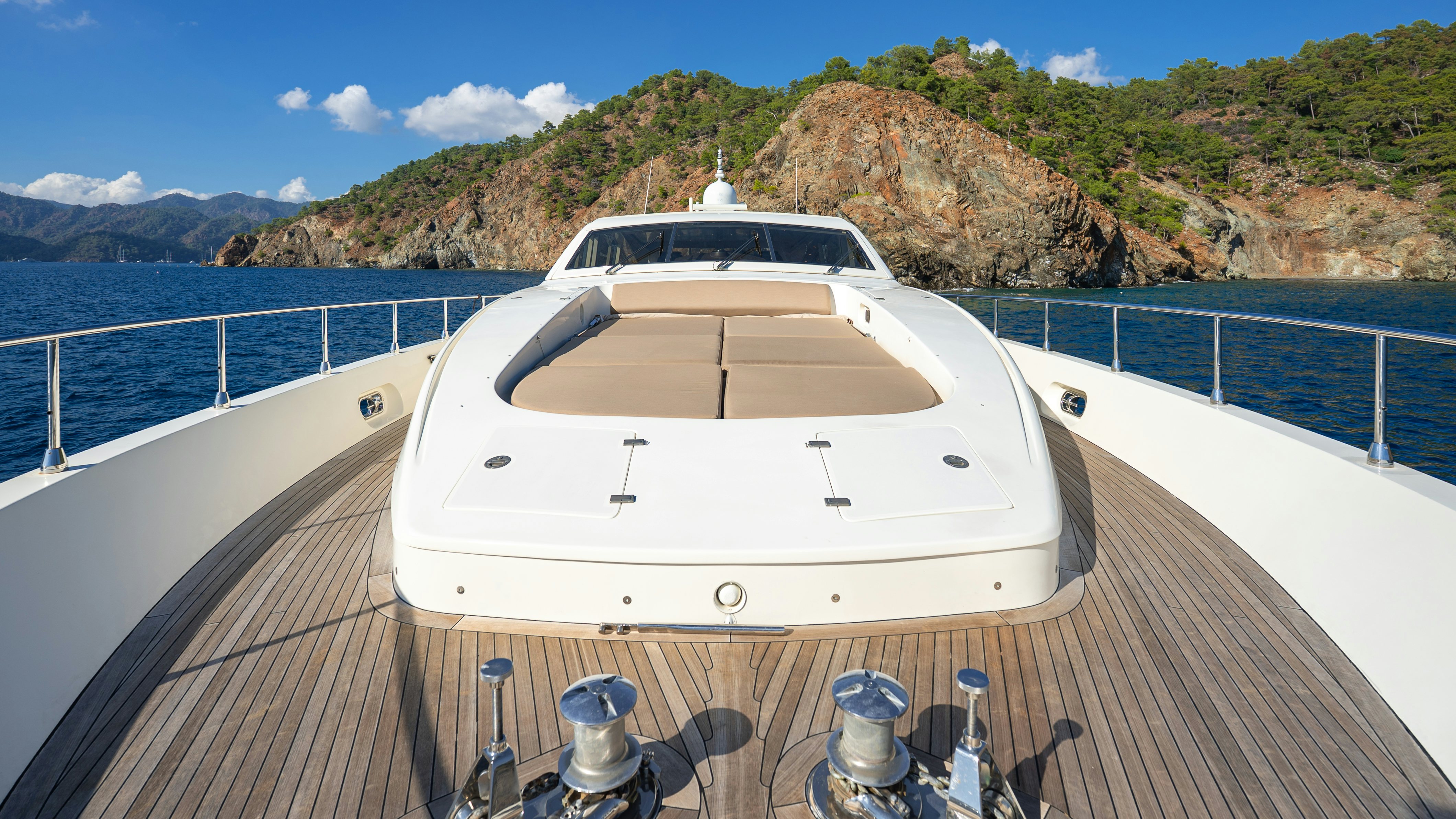 a white boat on a deck aboard CLARITA Yacht for Sale