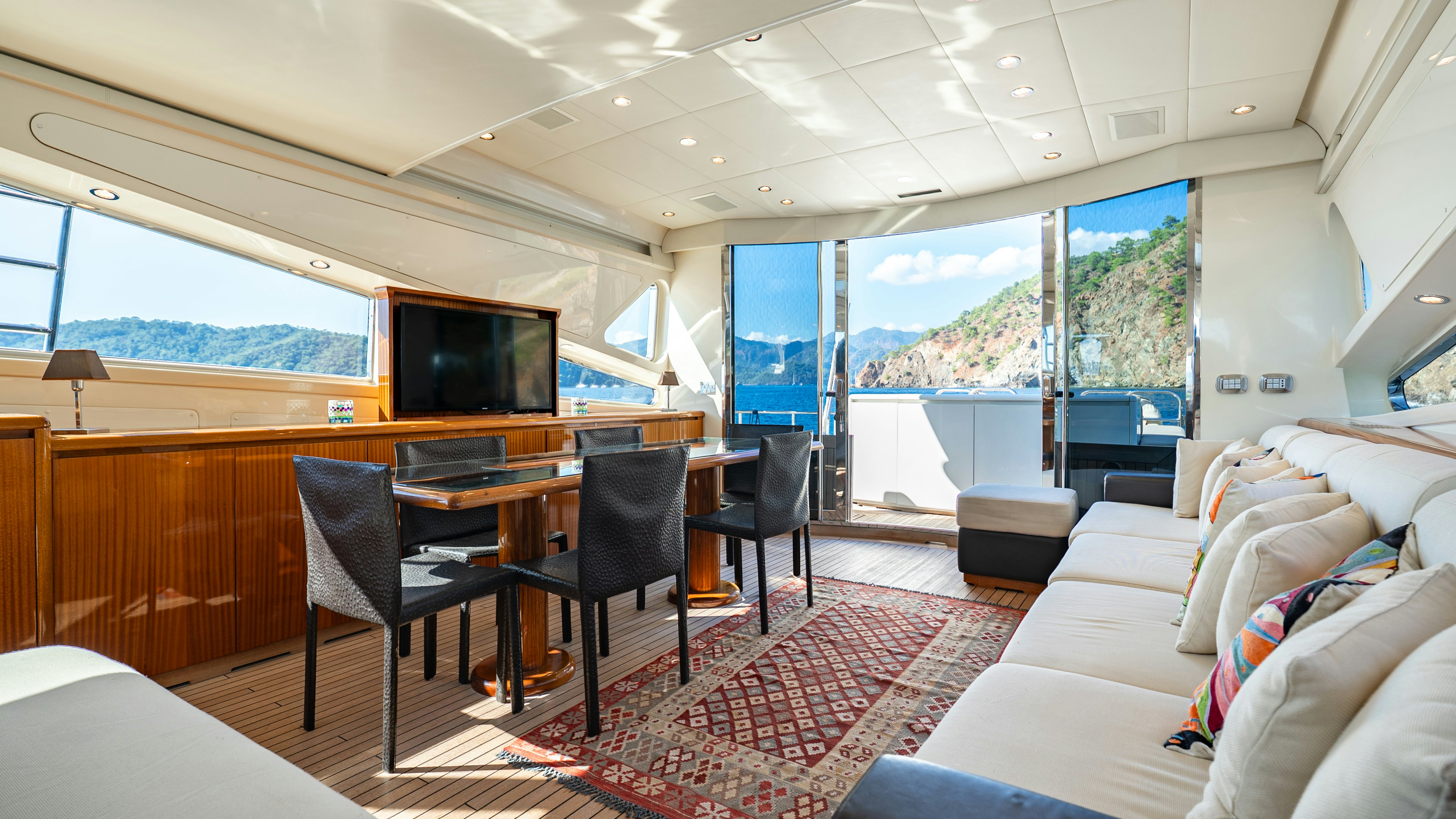 a room with a couch and a tv aboard CLARITA Yacht for Sale