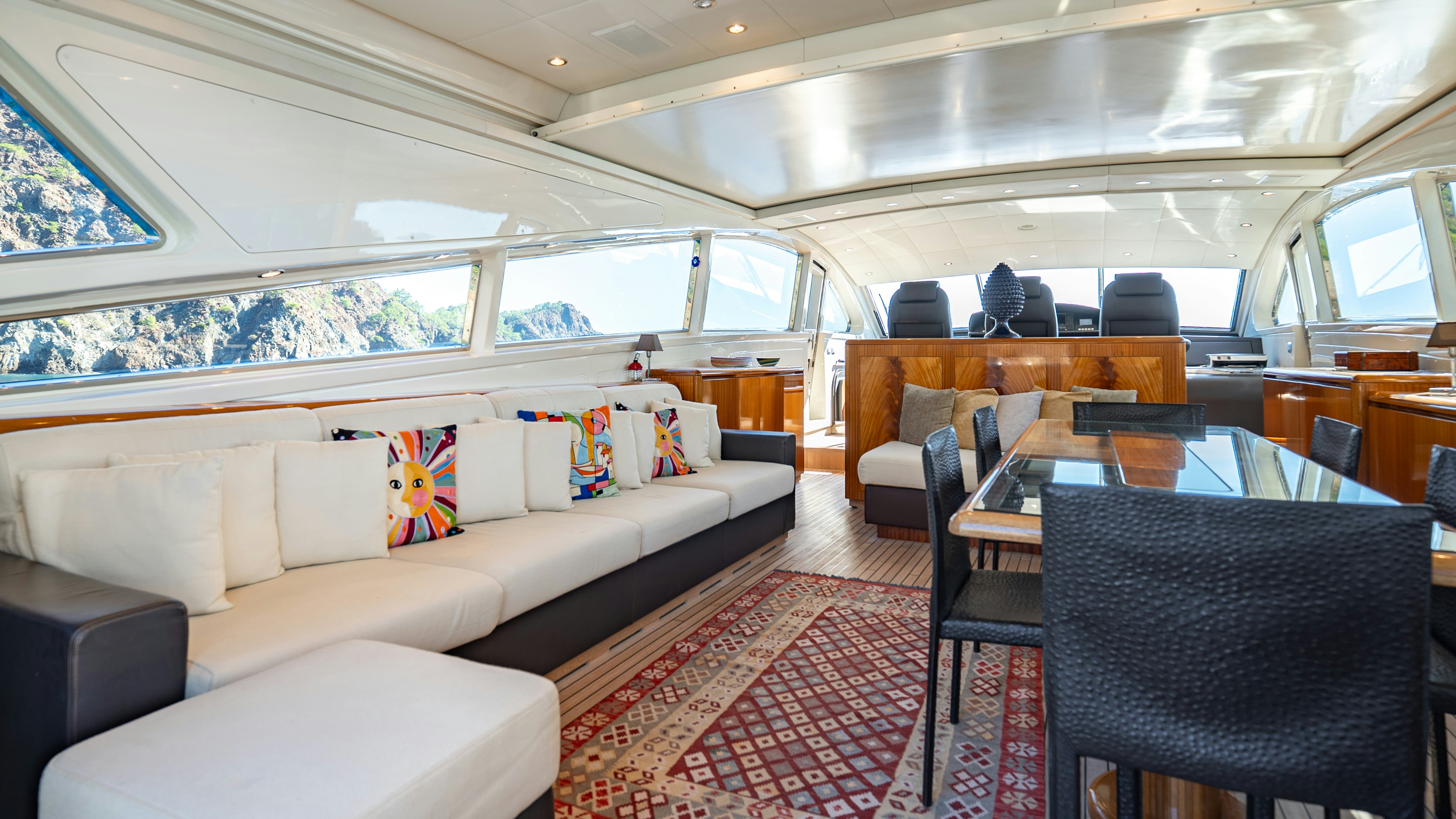 a living room with a couch and a table aboard CLARITA Yacht for Sale