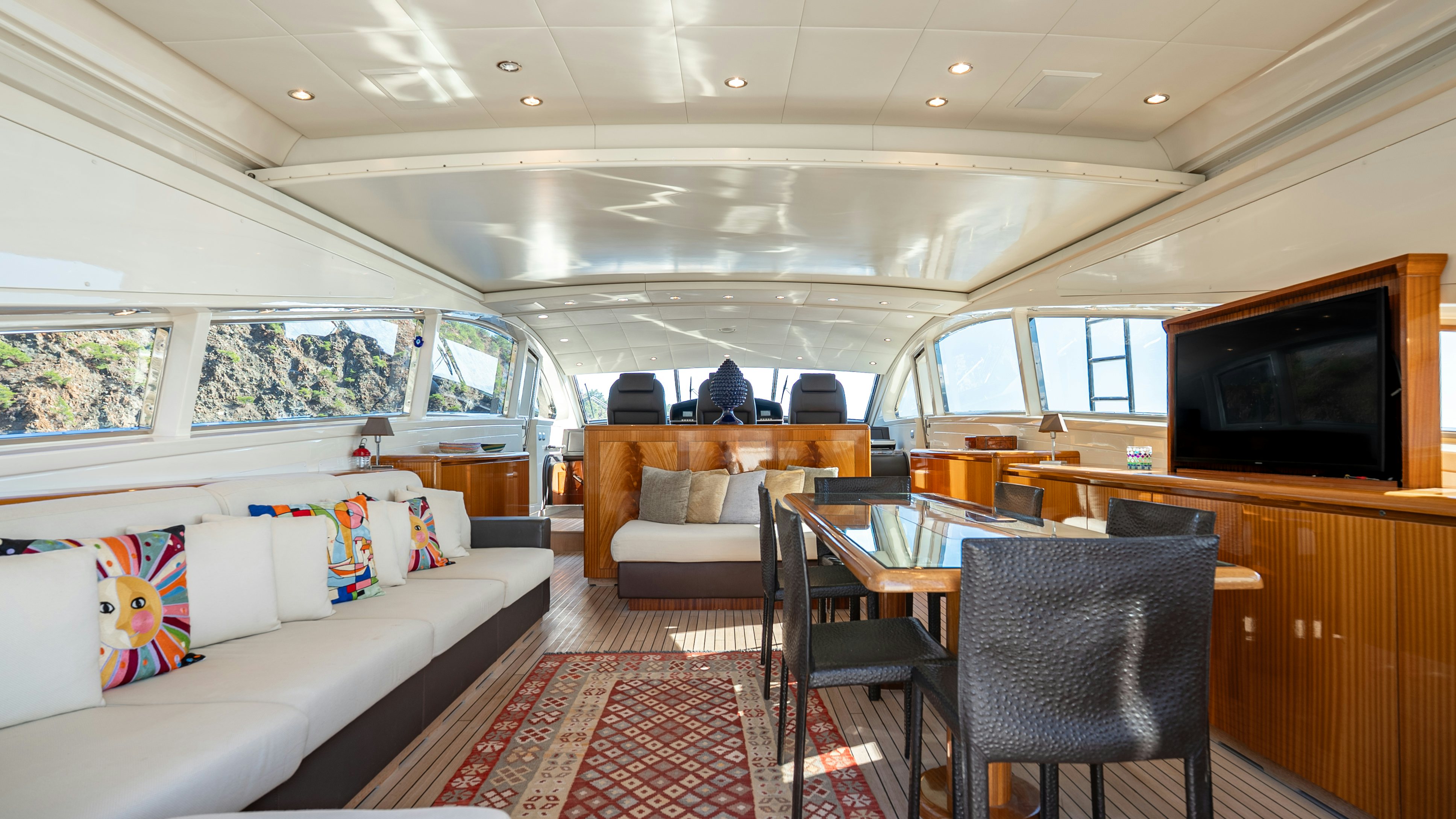 a living room with a couch and a television aboard CLARITA Yacht for Sale