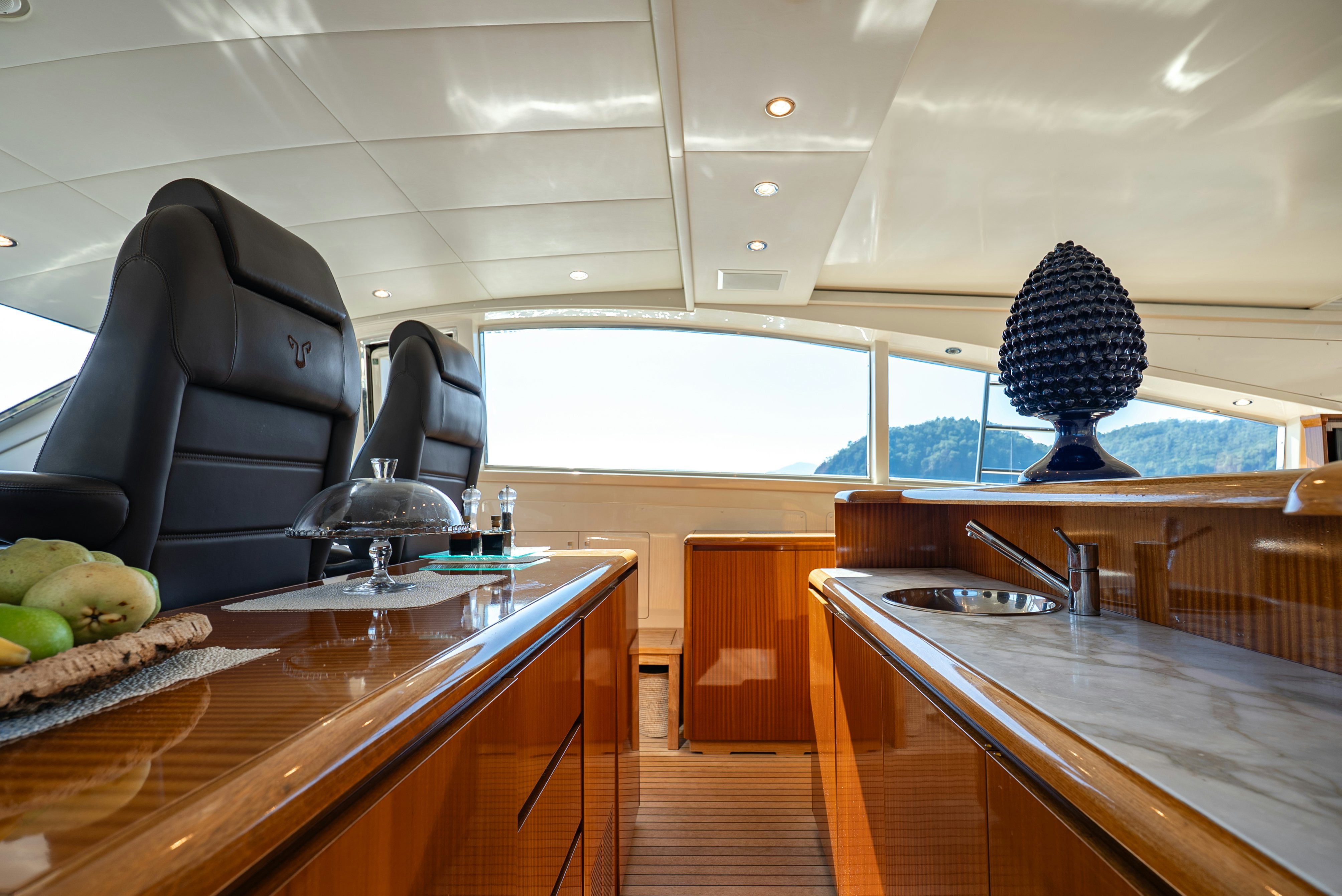 a room with a table and chairs aboard CLARITA Yacht for Sale