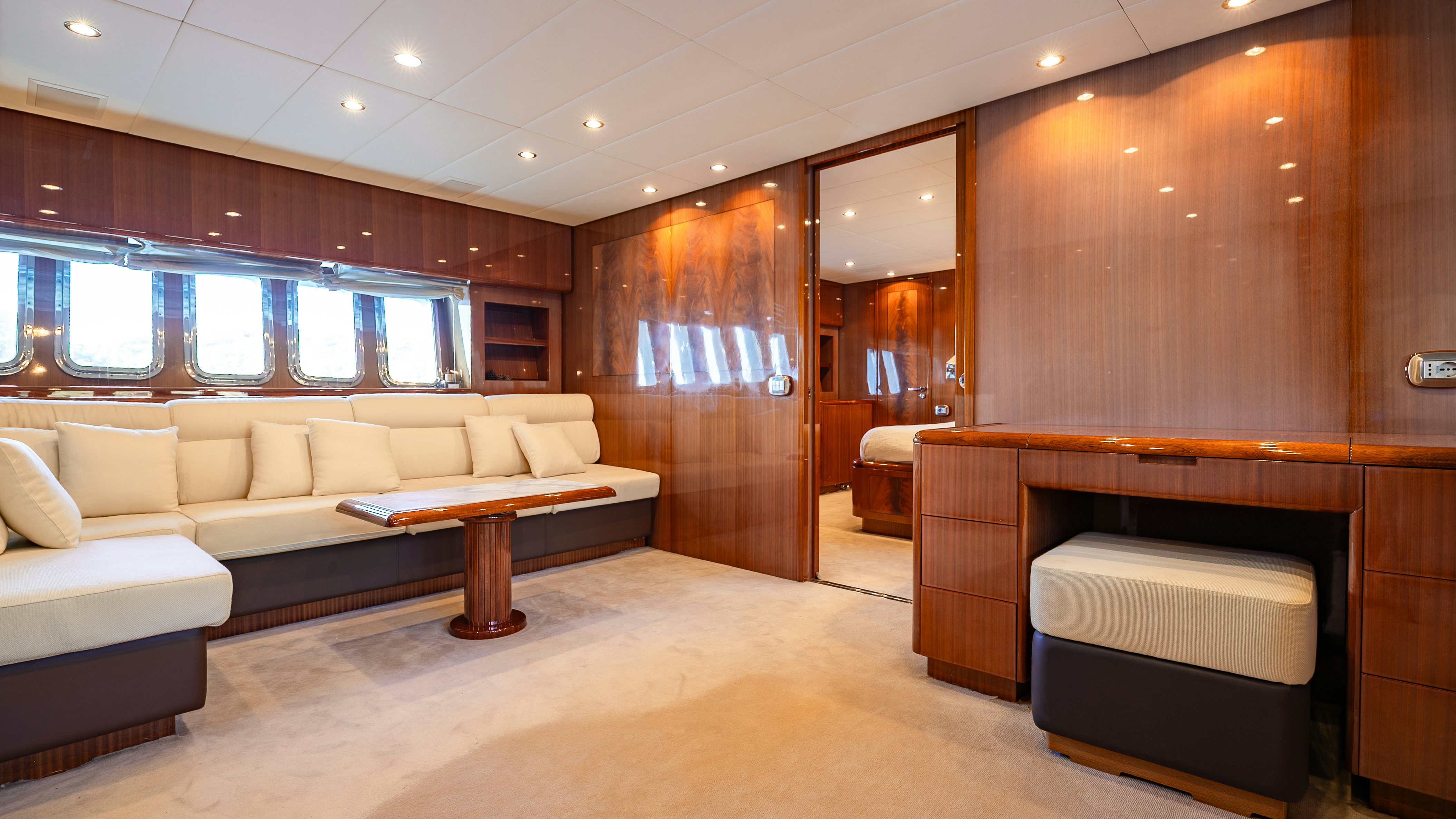 a large living room with a large bed and a couch aboard CLARITA Yacht for Sale