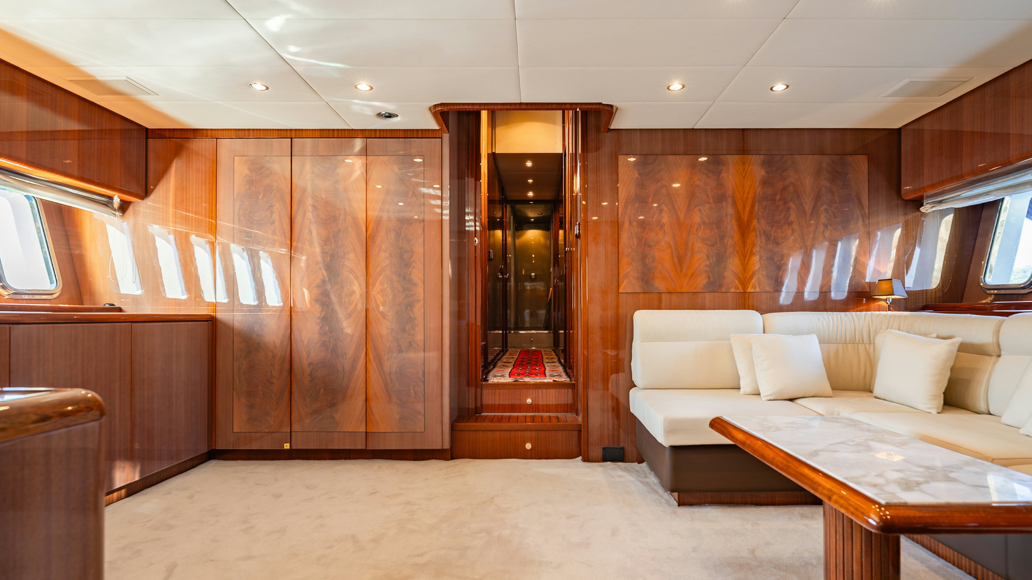 a room with a couch and a table aboard CLARITA Yacht for Sale