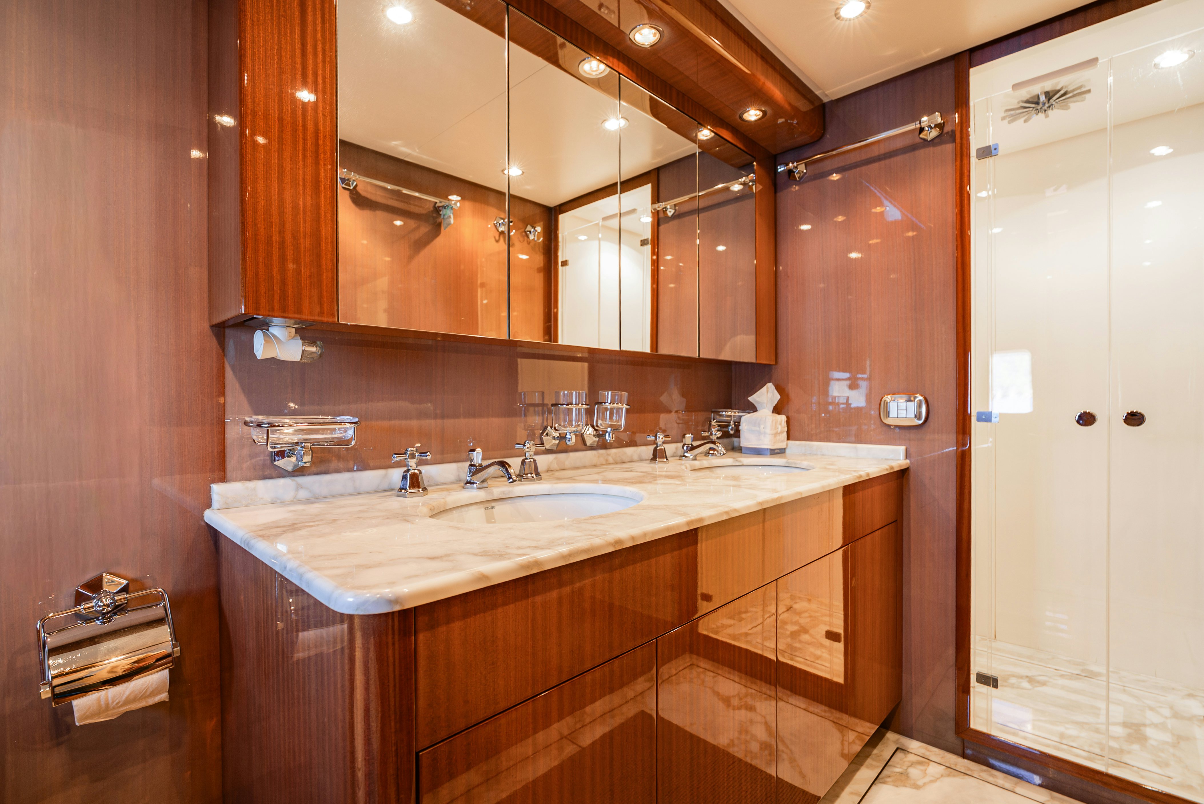 a bathroom with a large mirror aboard CLARITA Yacht for Sale