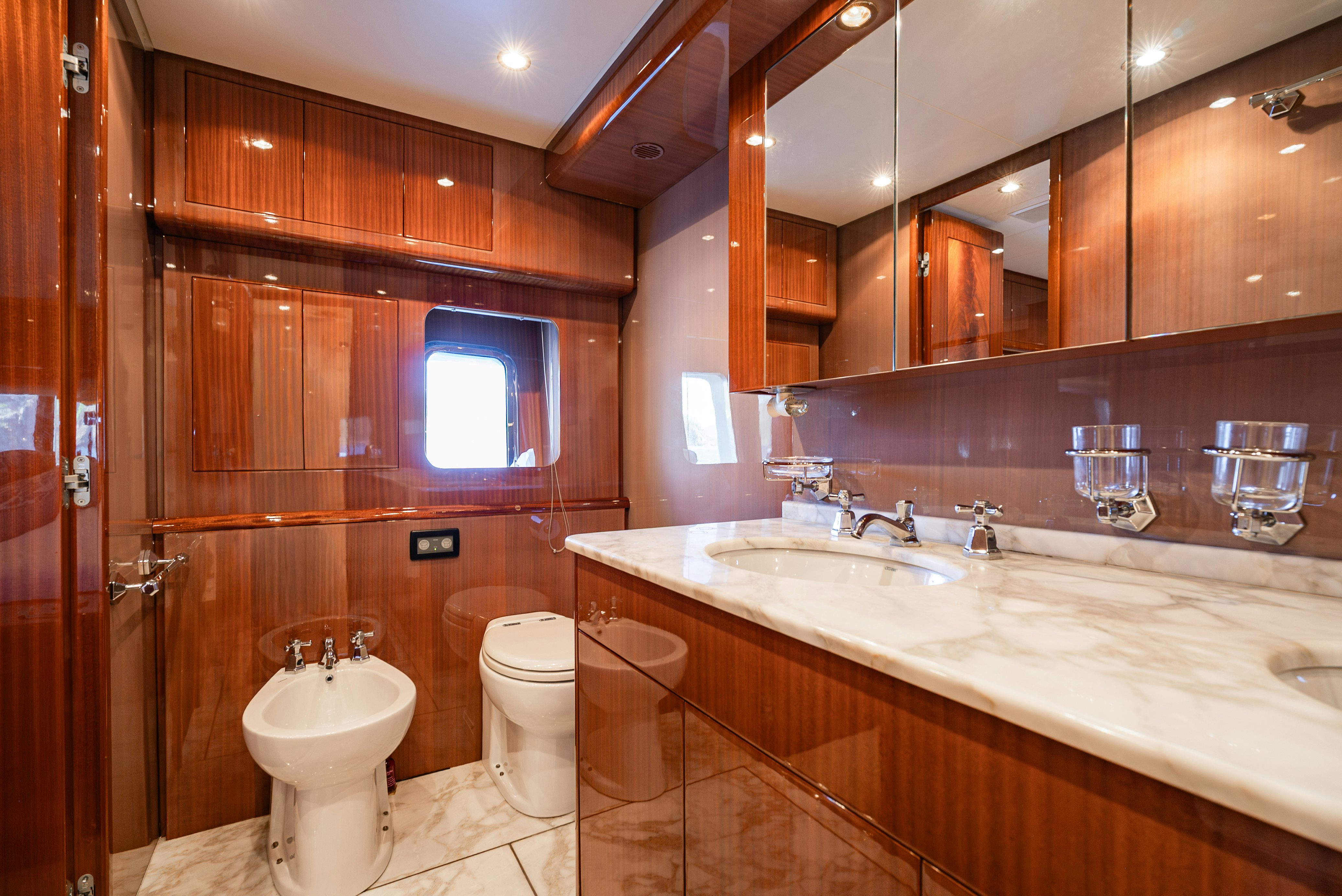 a bathroom with a large mirror aboard CLARITA Yacht for Sale