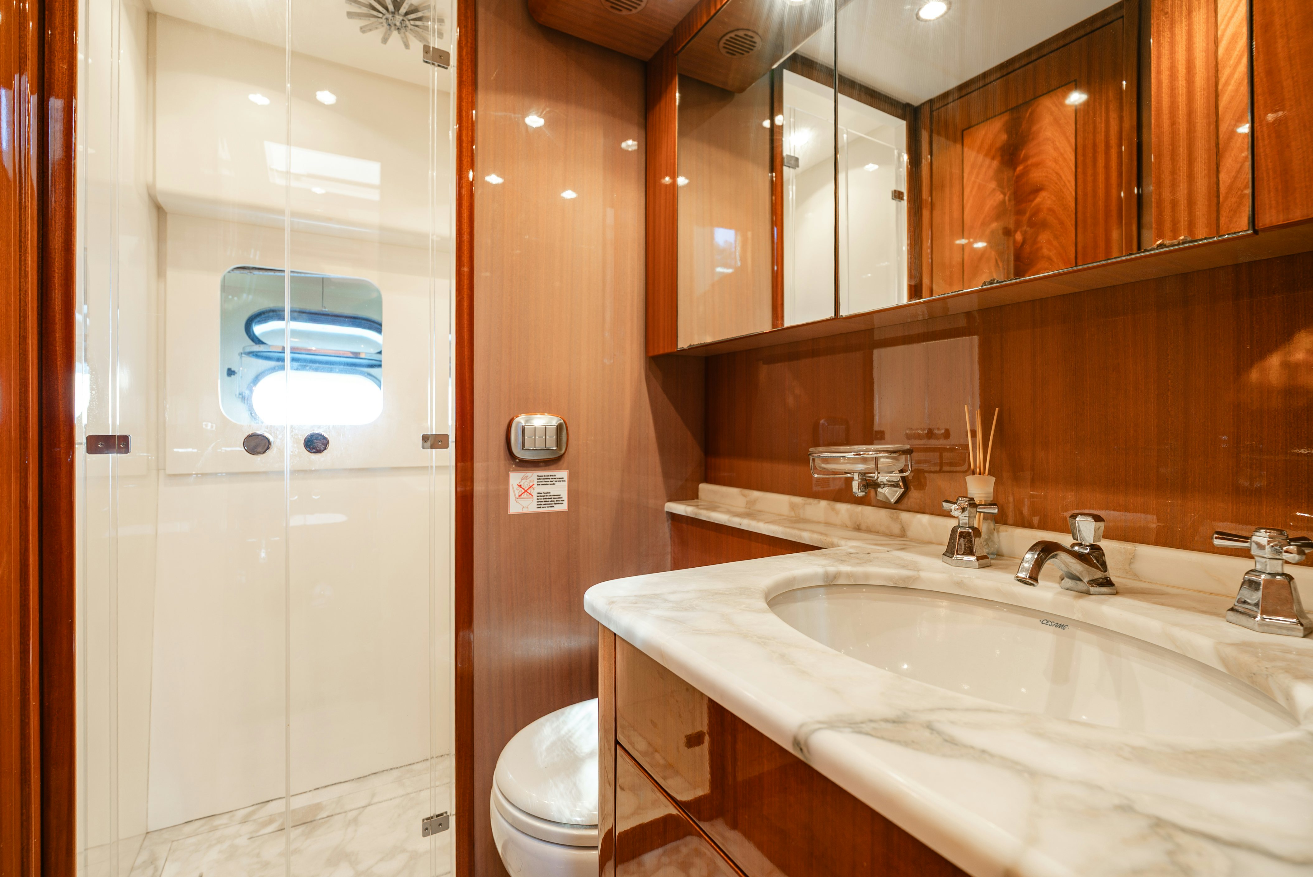 a bathroom with a sink and a toilet aboard CLARITA Yacht for Sale