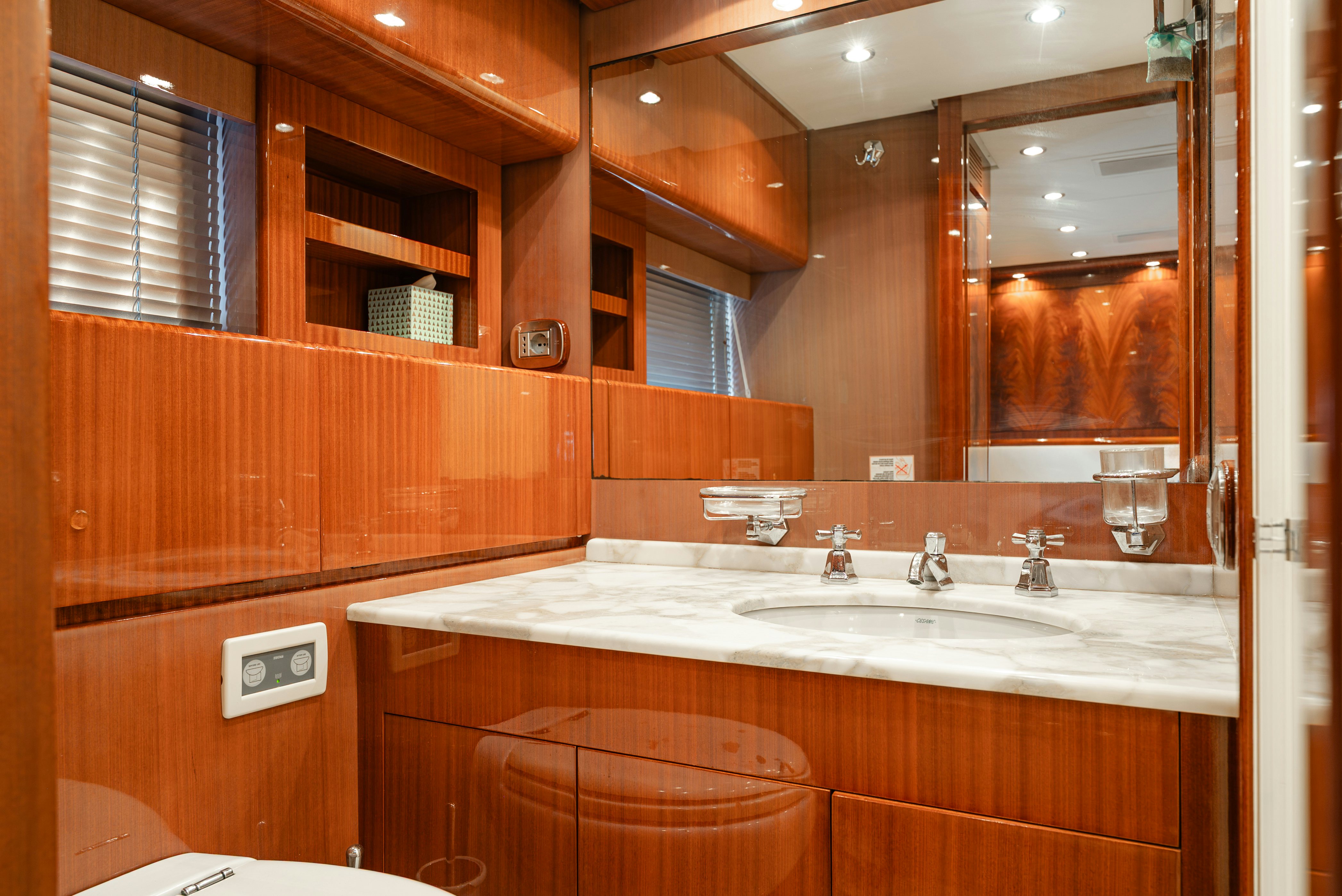 a bathroom with a large mirror aboard CLARITA Yacht for Sale