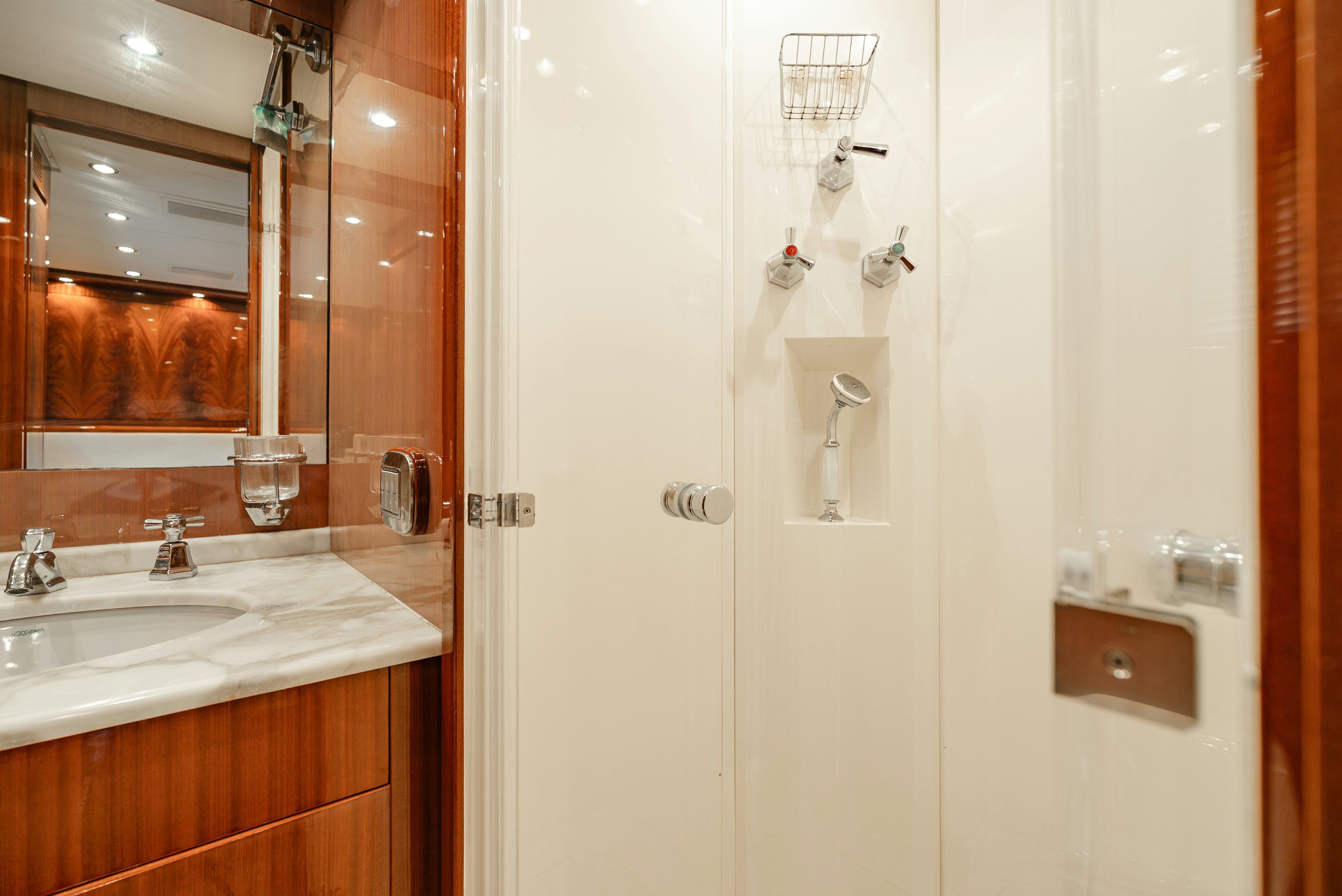 a bathroom with a shower and sink aboard CLARITA Yacht for Sale