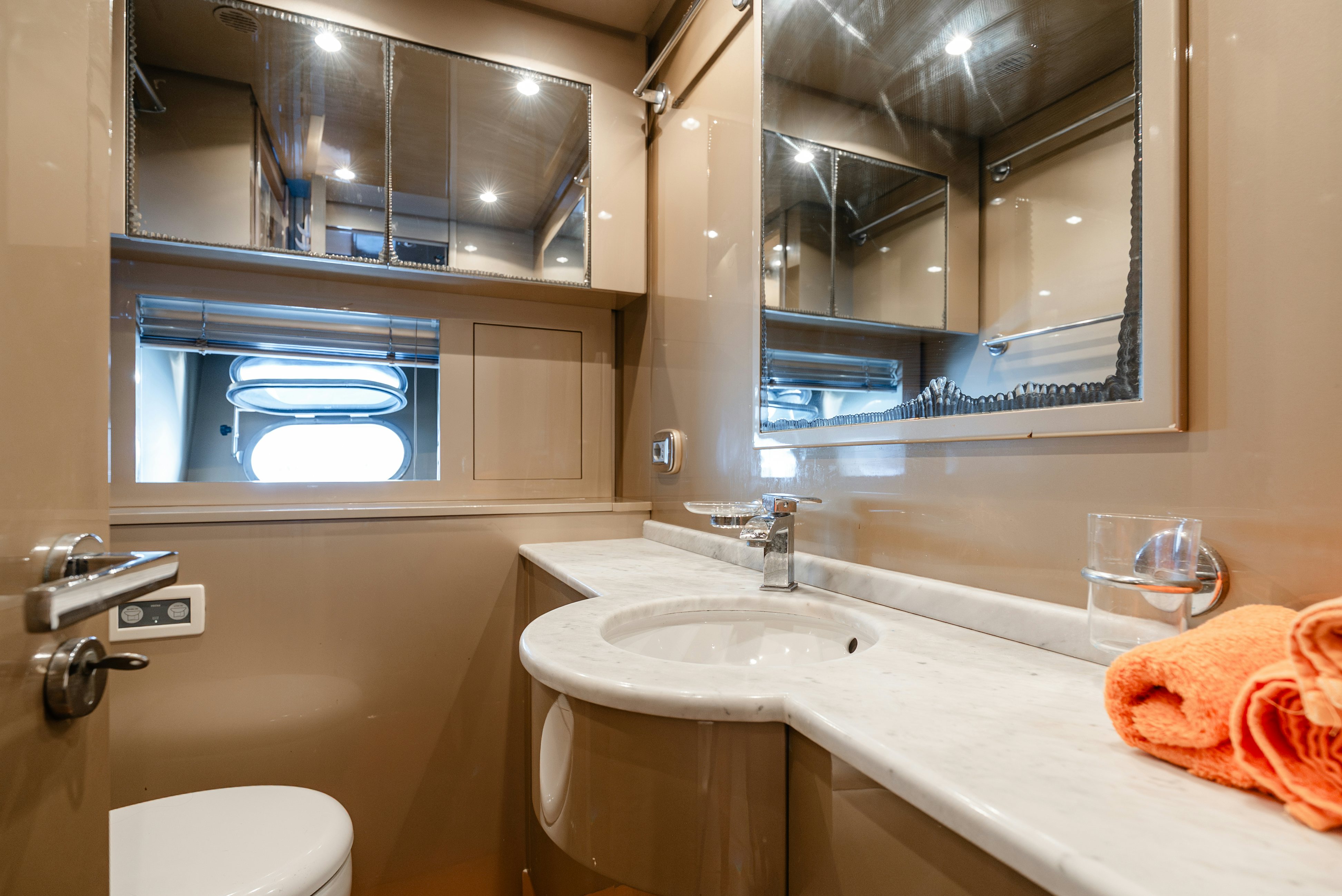 a bathroom with a large mirror aboard CLARITA Yacht for Sale