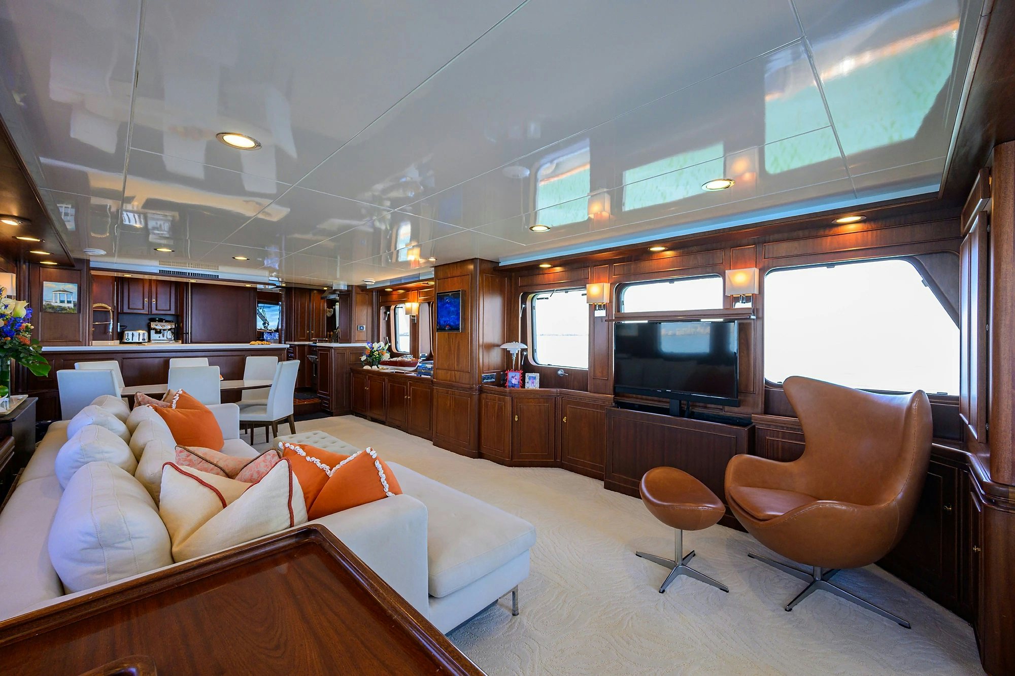 a living room with a couch and a television aboard AVENTURER Yacht for Sale
