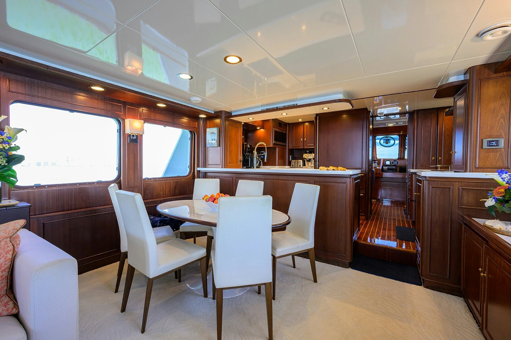 a kitchen with a dining table aboard AVENTURER Yacht for Sale
