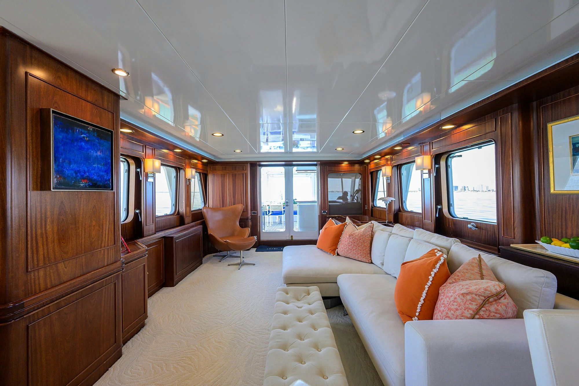 a living room with a couch and a television aboard AVENTURER Yacht for Sale