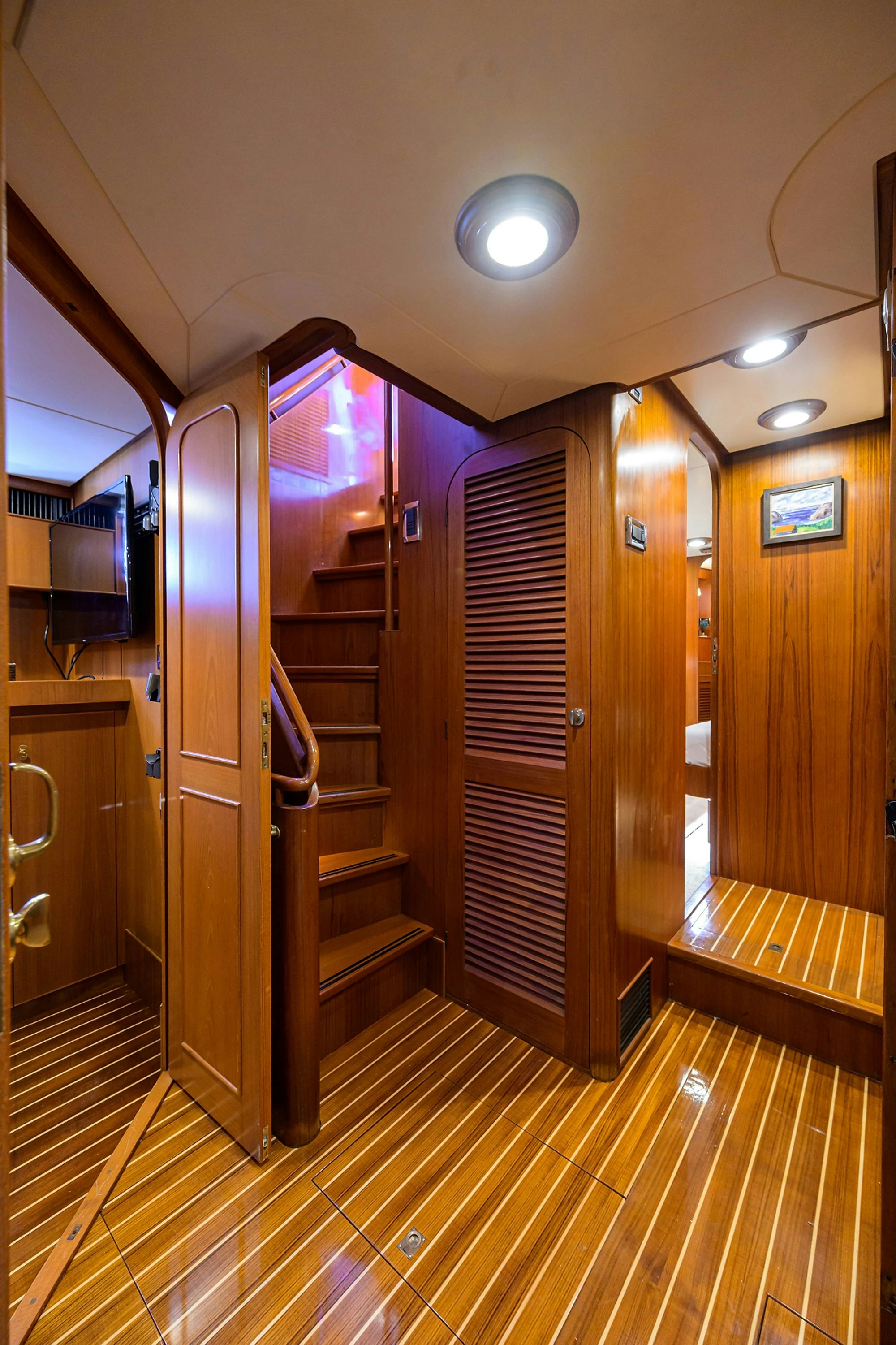 a room with a wood floor and a wood door and a wood floor aboard AVENTURER Yacht for Sale