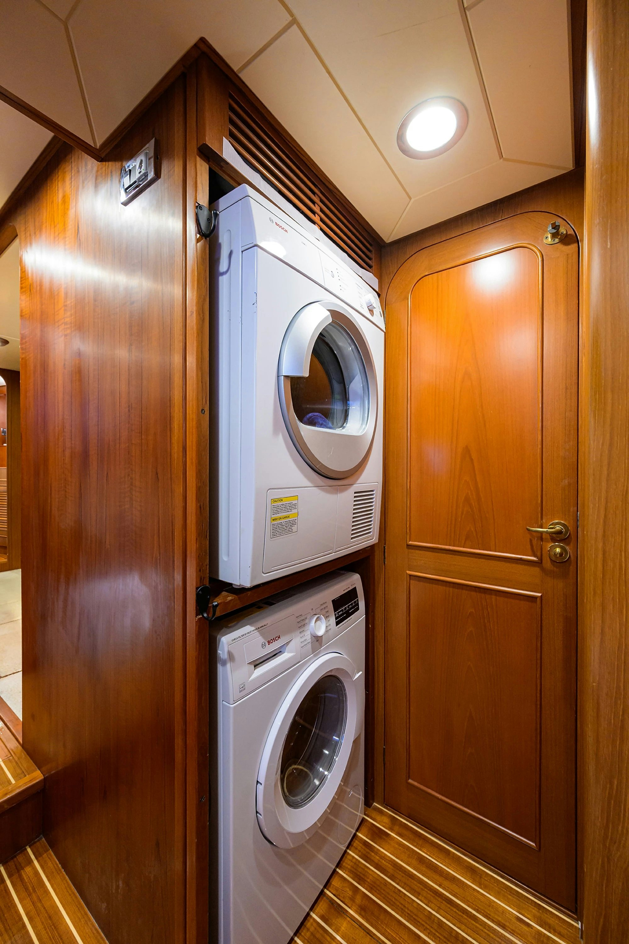 a washer and dryer in a room aboard AVENTURER Yacht for Sale