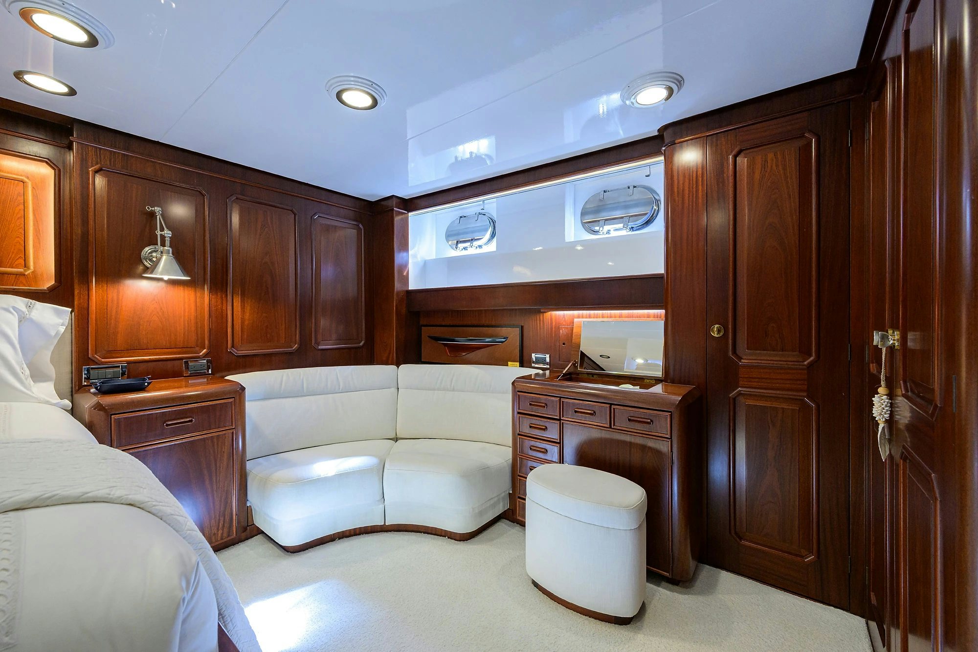 a room with a couch and a cupboard aboard AVENTURER Yacht for Sale