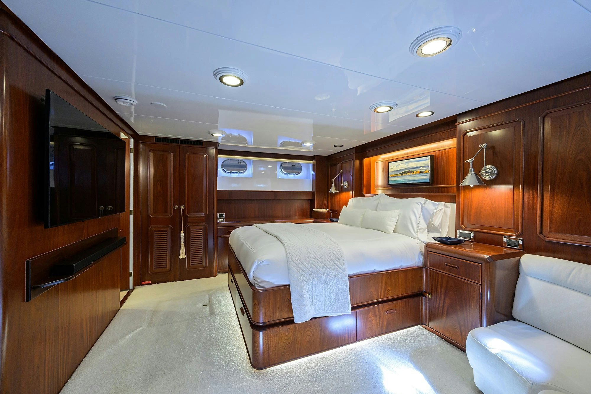 a room with a bed and a desk aboard AVENTURER Yacht for Sale