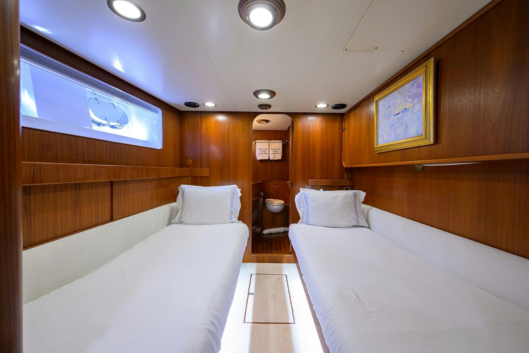 a room with a bed and a mirror aboard AVENTURER Yacht for Sale