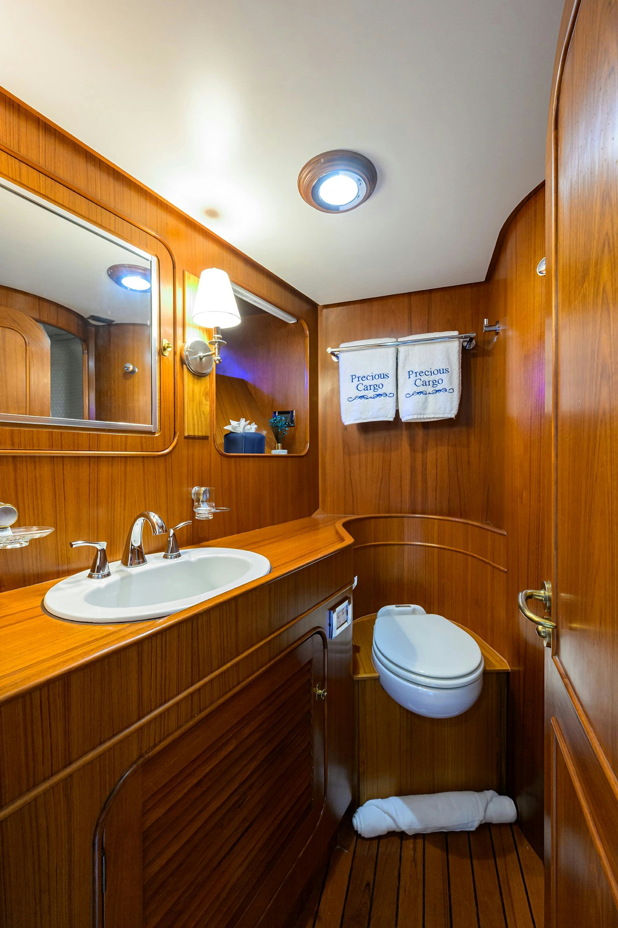 a bathroom with a toilet and a sink aboard AVENTURER Yacht for Sale