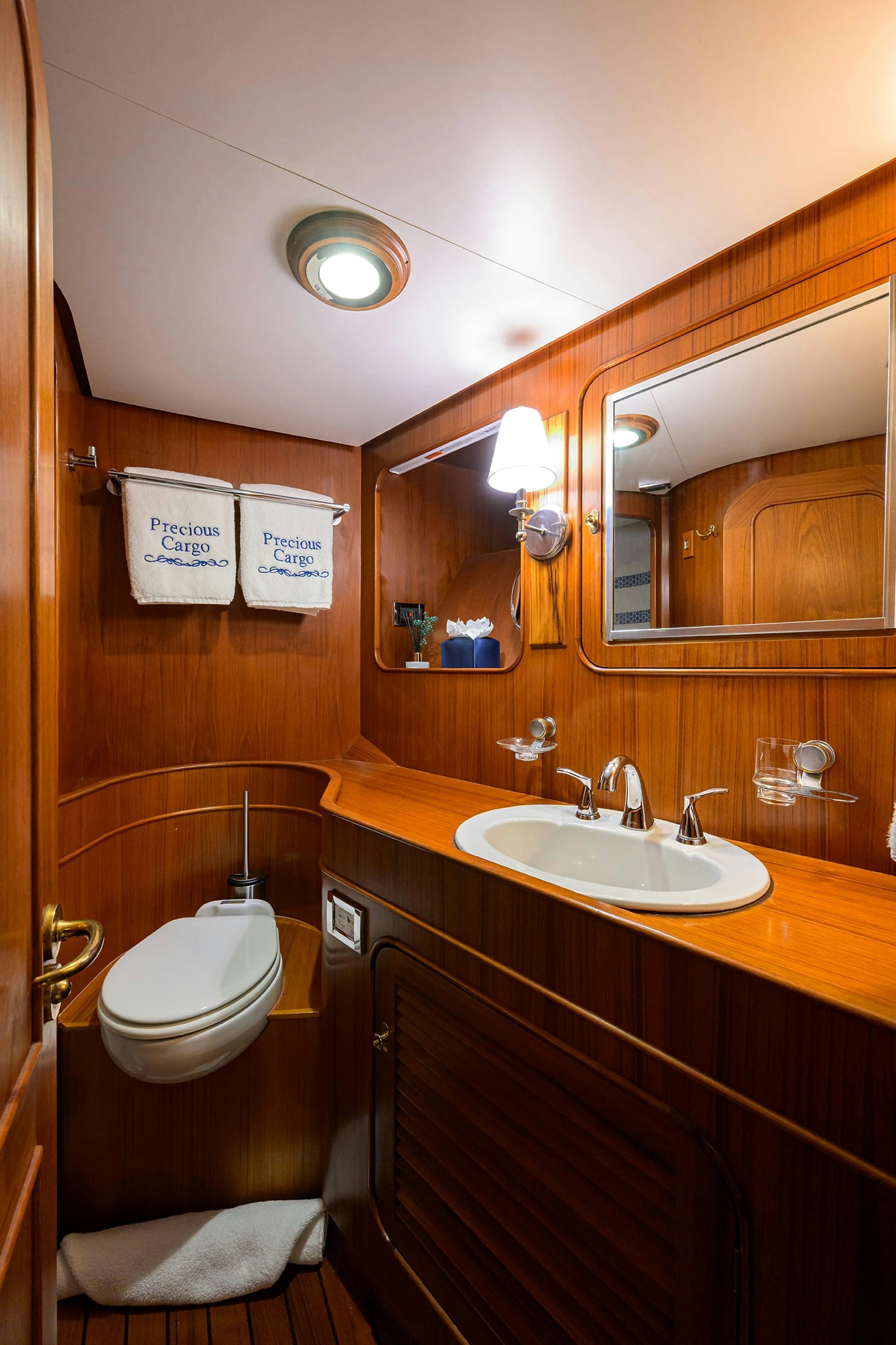 a bathroom with a toilet and a sink aboard AVENTURER Yacht for Sale