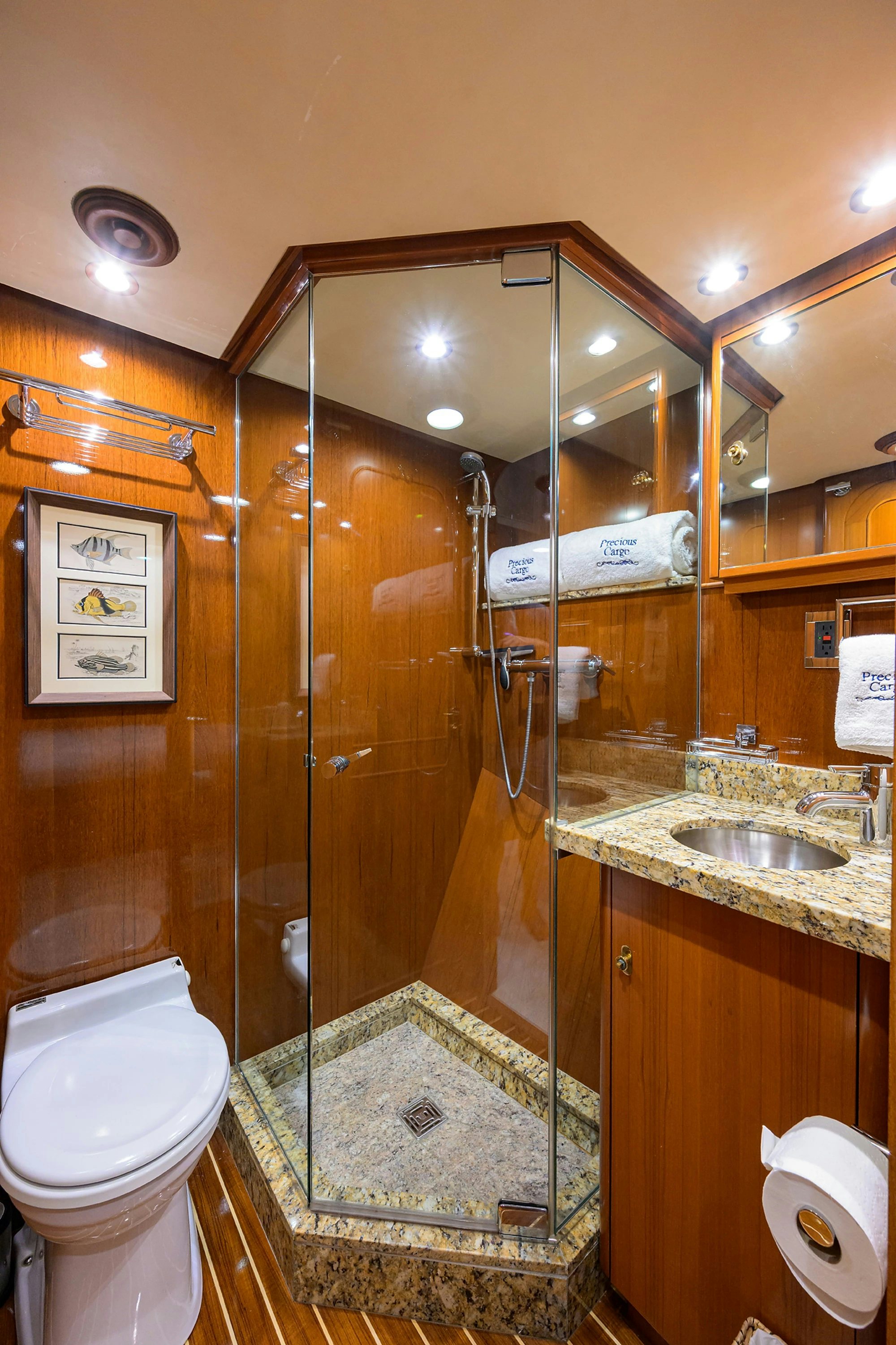 a bathroom with a glass shower aboard AVENTURER Yacht for Sale